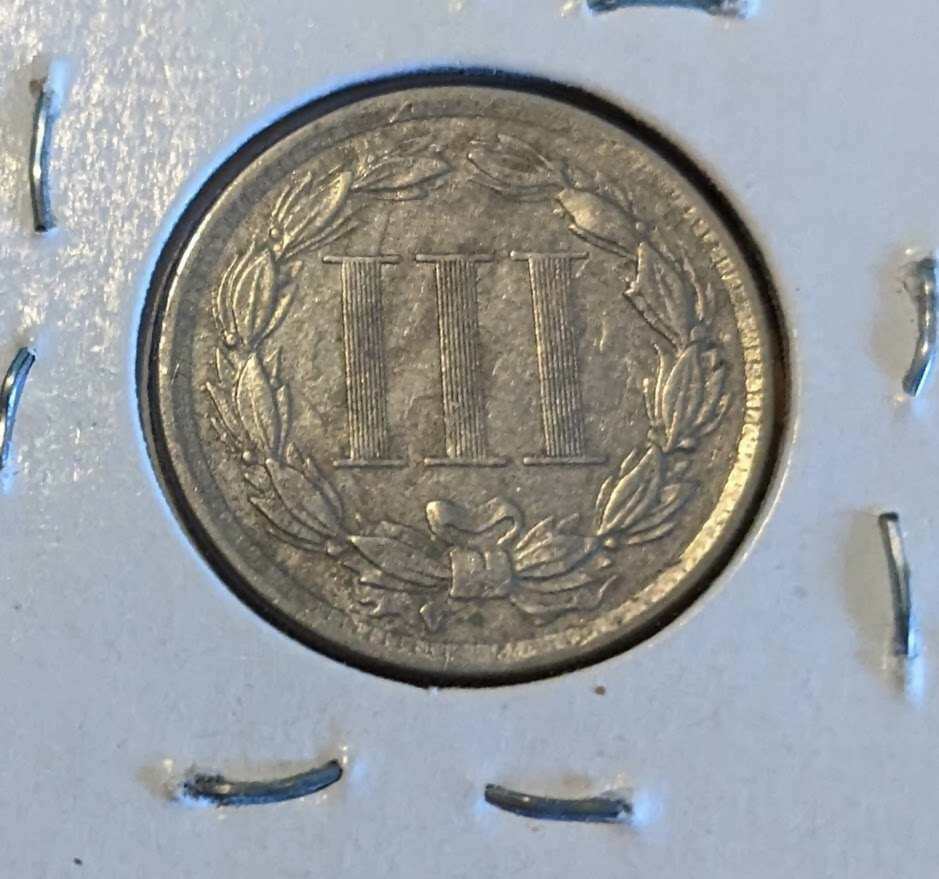 1865 Three-Cent Piece (nickel) coin in extra fine condition, historic collectible.