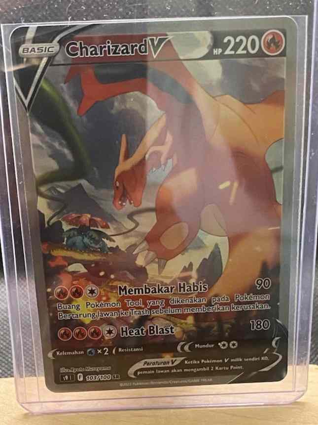 Charizard V S9 103/100 SR Alternate Art Pokemon TCG Indonesia card in protective sleeve.