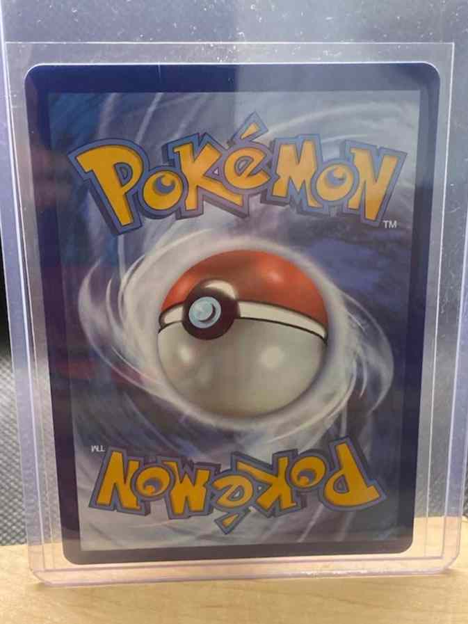 2022 Brilliant Stars #174/172 Charizard VSTAR (Secret) card in protective sleeve.