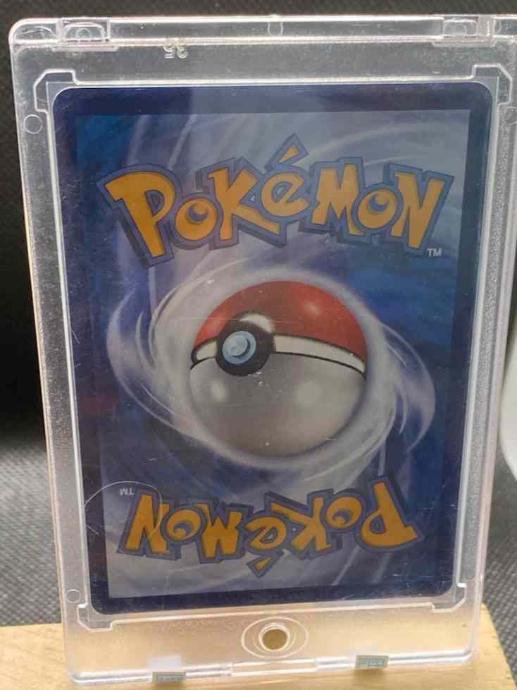 Gengar & Mimikyu alt art holo Pokemon card in protective case.