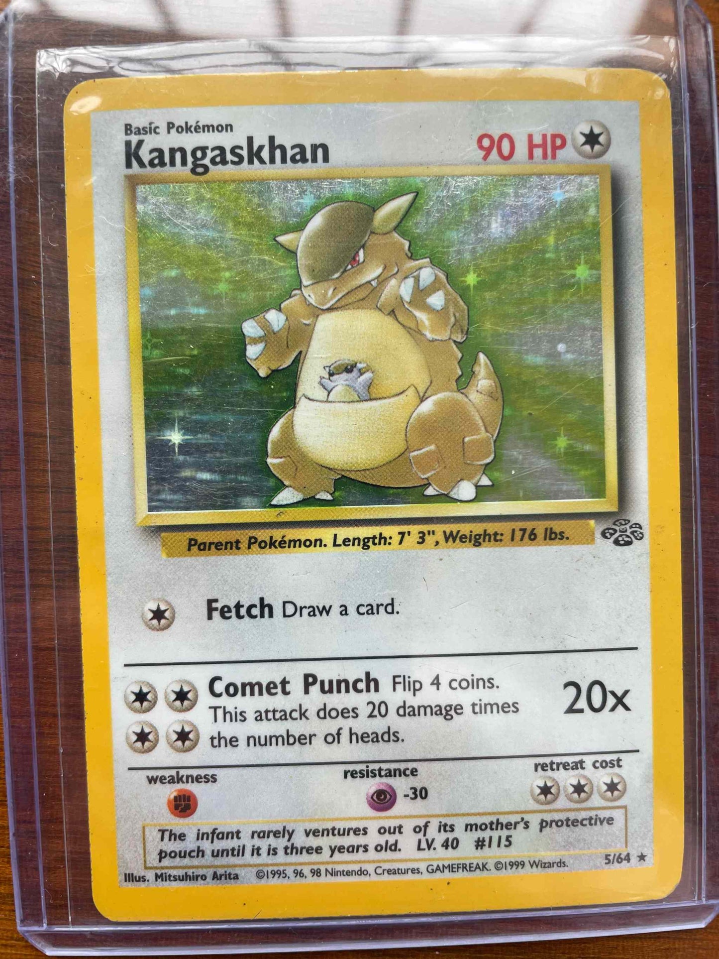 Base Set 2 #5/64 Kangaskhan Pokémon card in protective sleeve.