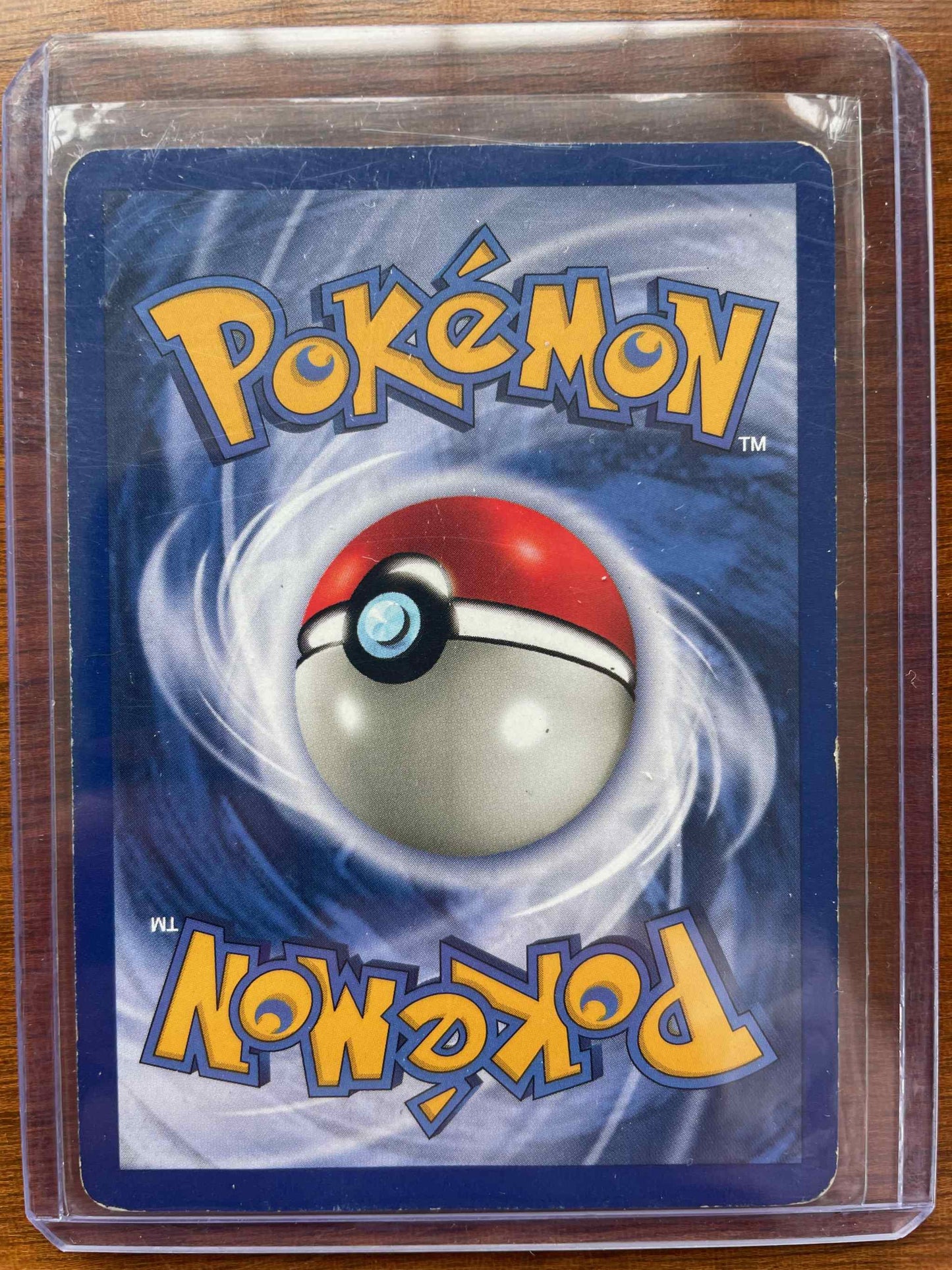 Jungle #15/64 Vileplume Pokémon card in protective case.