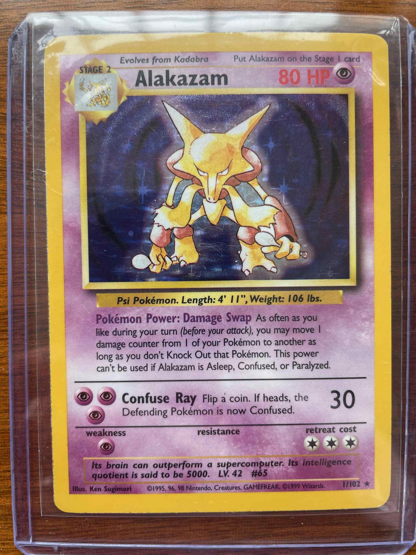 Rare Base Set Alakazam Pokémon card with psychic abilities.
