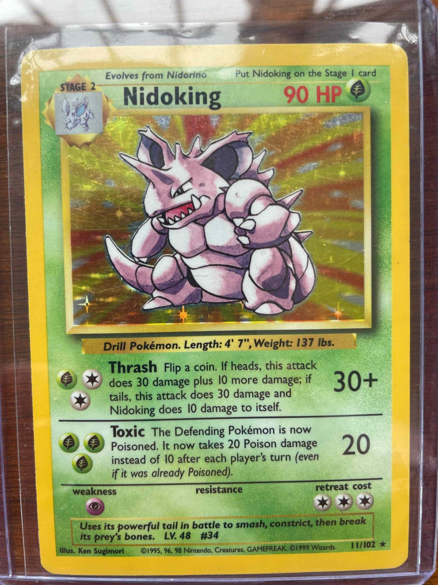 Base Set #011/102 Nidoking Pokémon card with powerful attacks and high HP.