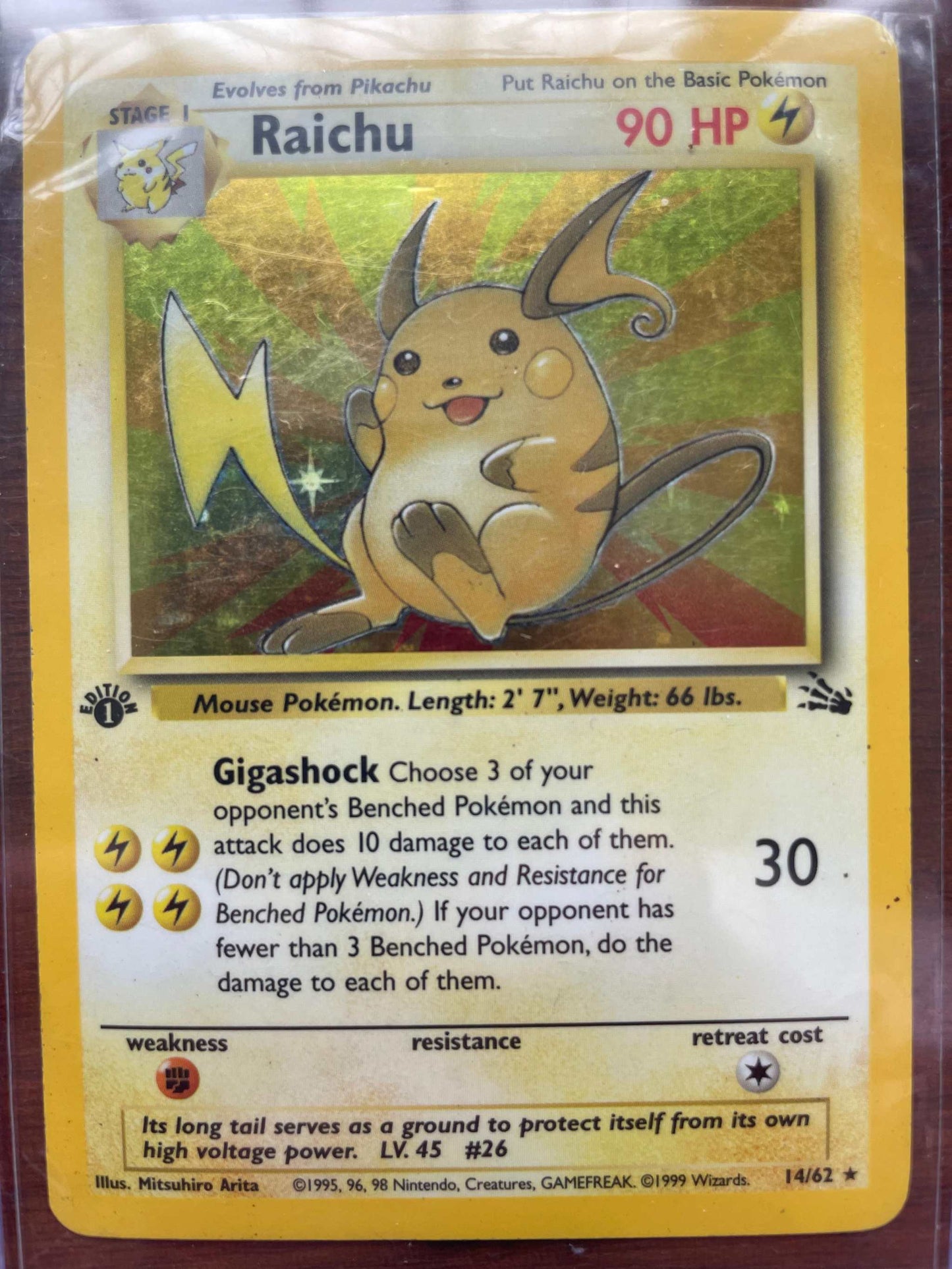 Fossil #14/62 Raichu Pokémon card, rare collectible.