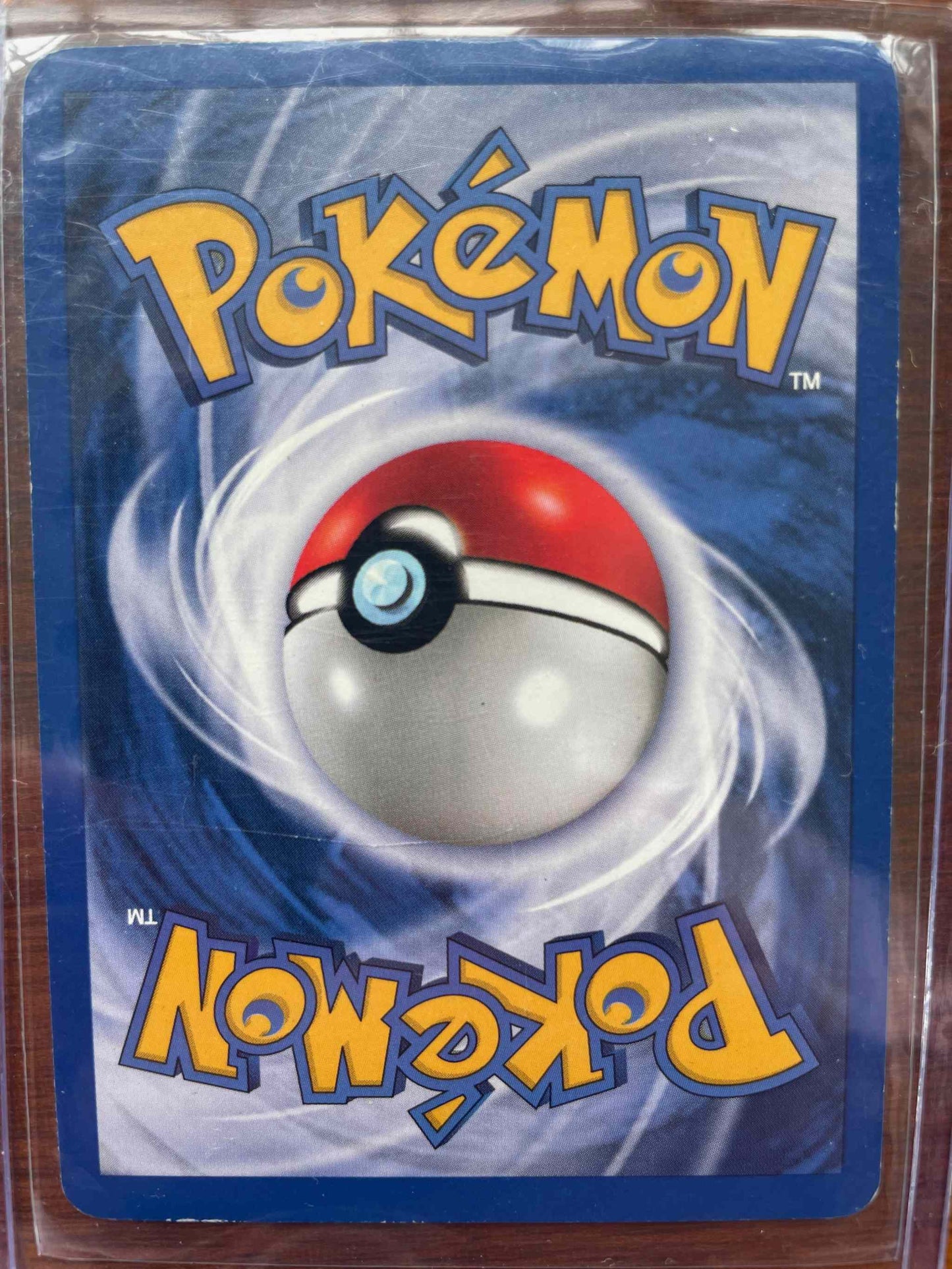 Team Rocket #1/82 Dark Alakazam Pokemon card back.