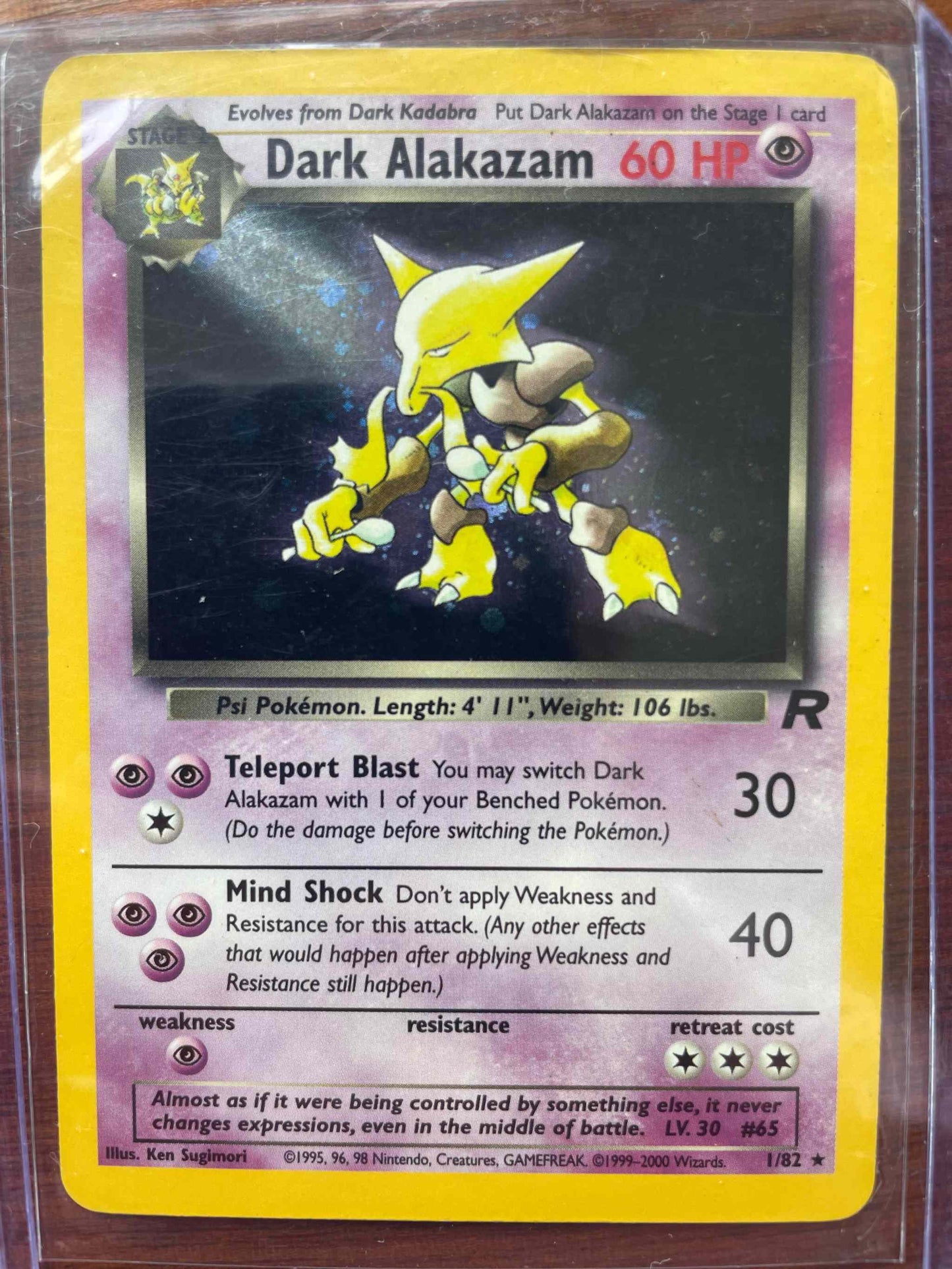 Team Rocket Dark Alakazam #1/82 trading card with unique design and rare appearance.