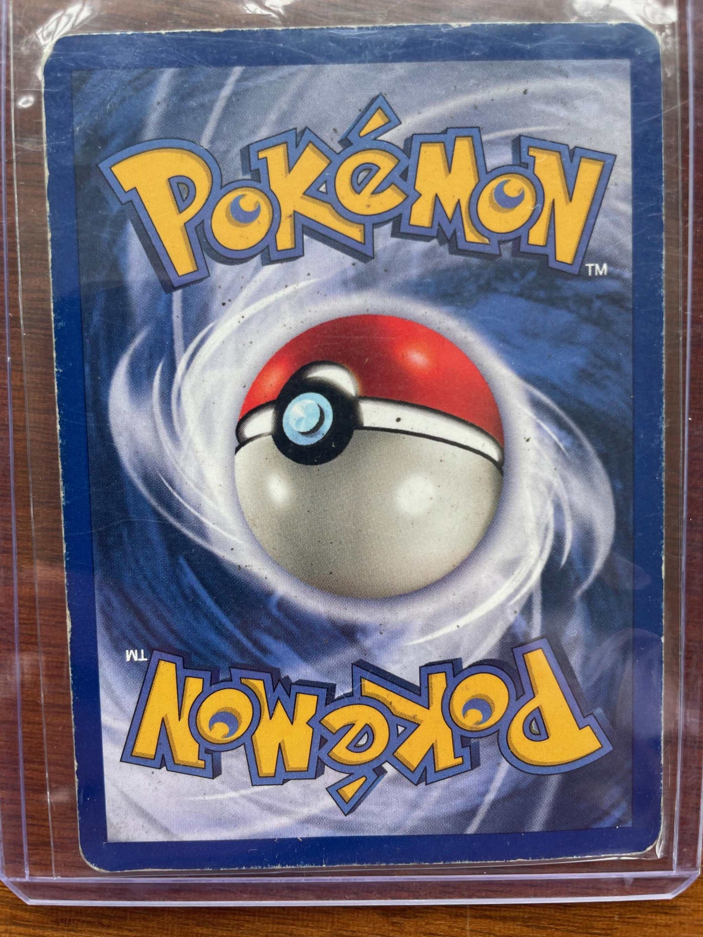 Jungle #04/64 Jolteon Pokémon card with electric-type design in protective case.