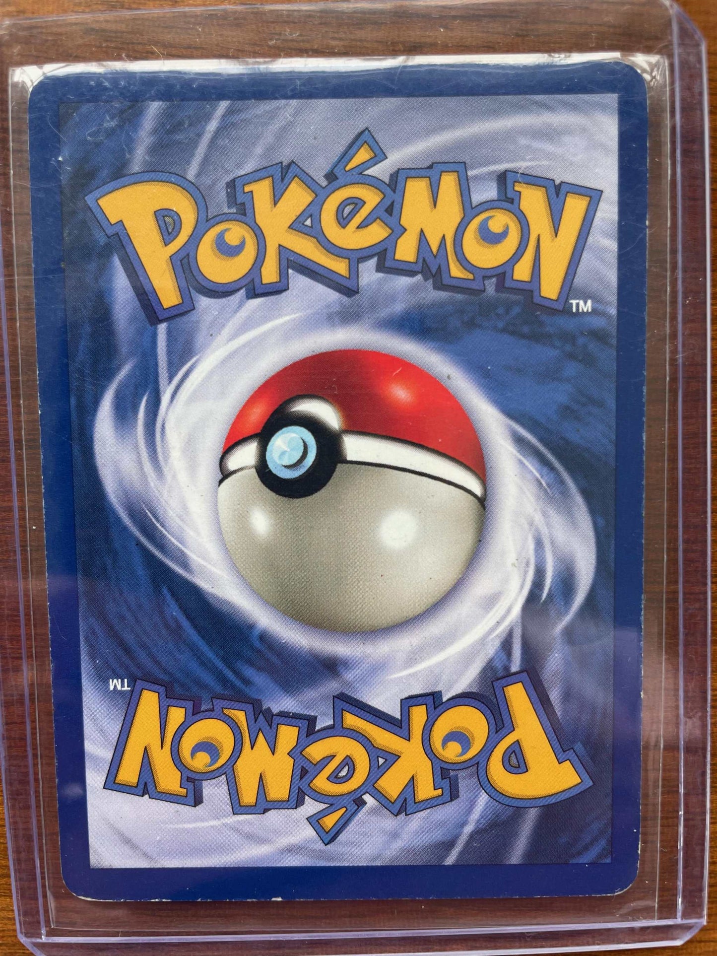 Pokemon Fossil #03/62 Ditto card in protective sleeve, featuring iconic design.