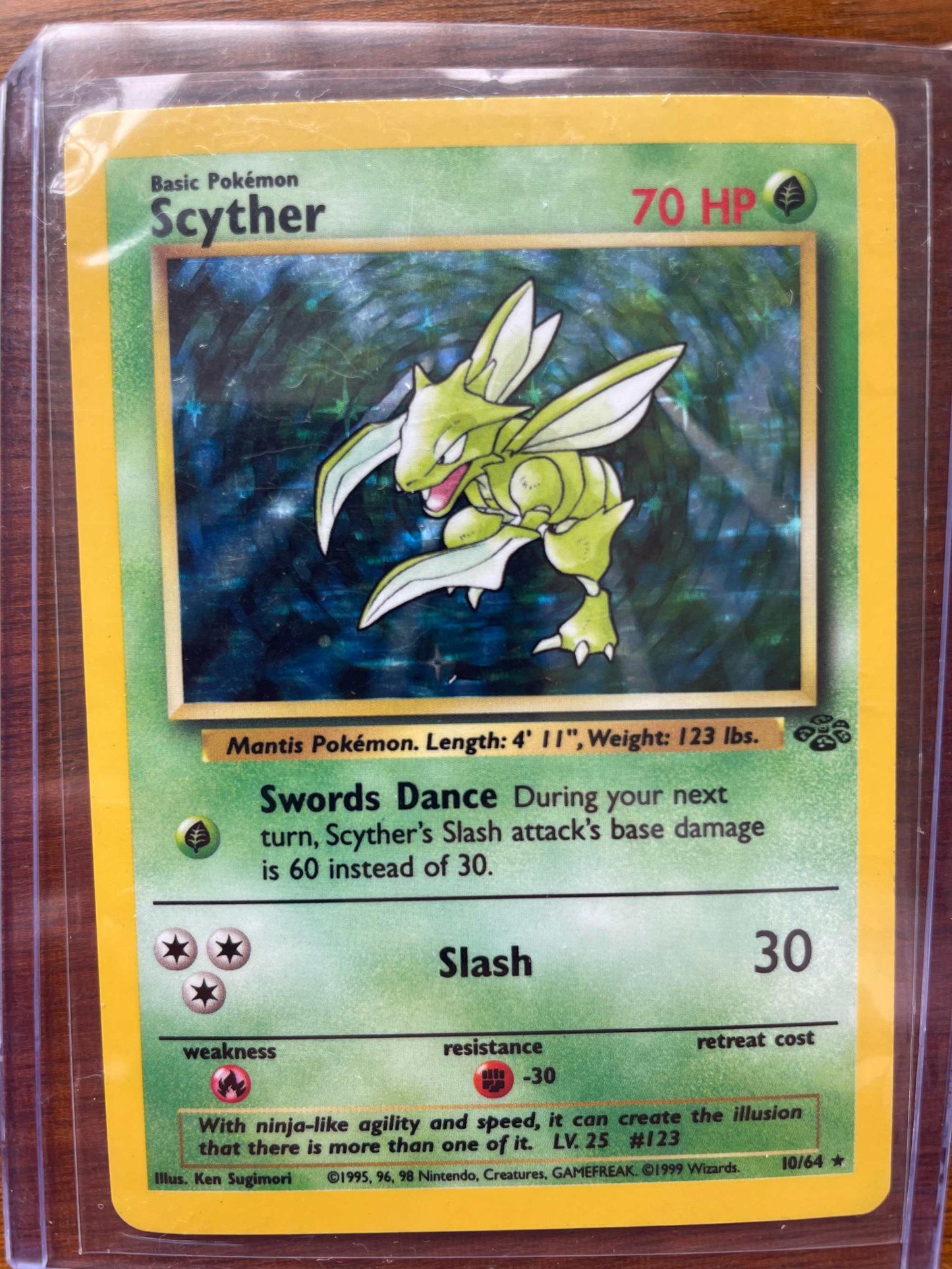 Jungle #10/64 Scyther Pokemon card with jungle theme and 70 HP.