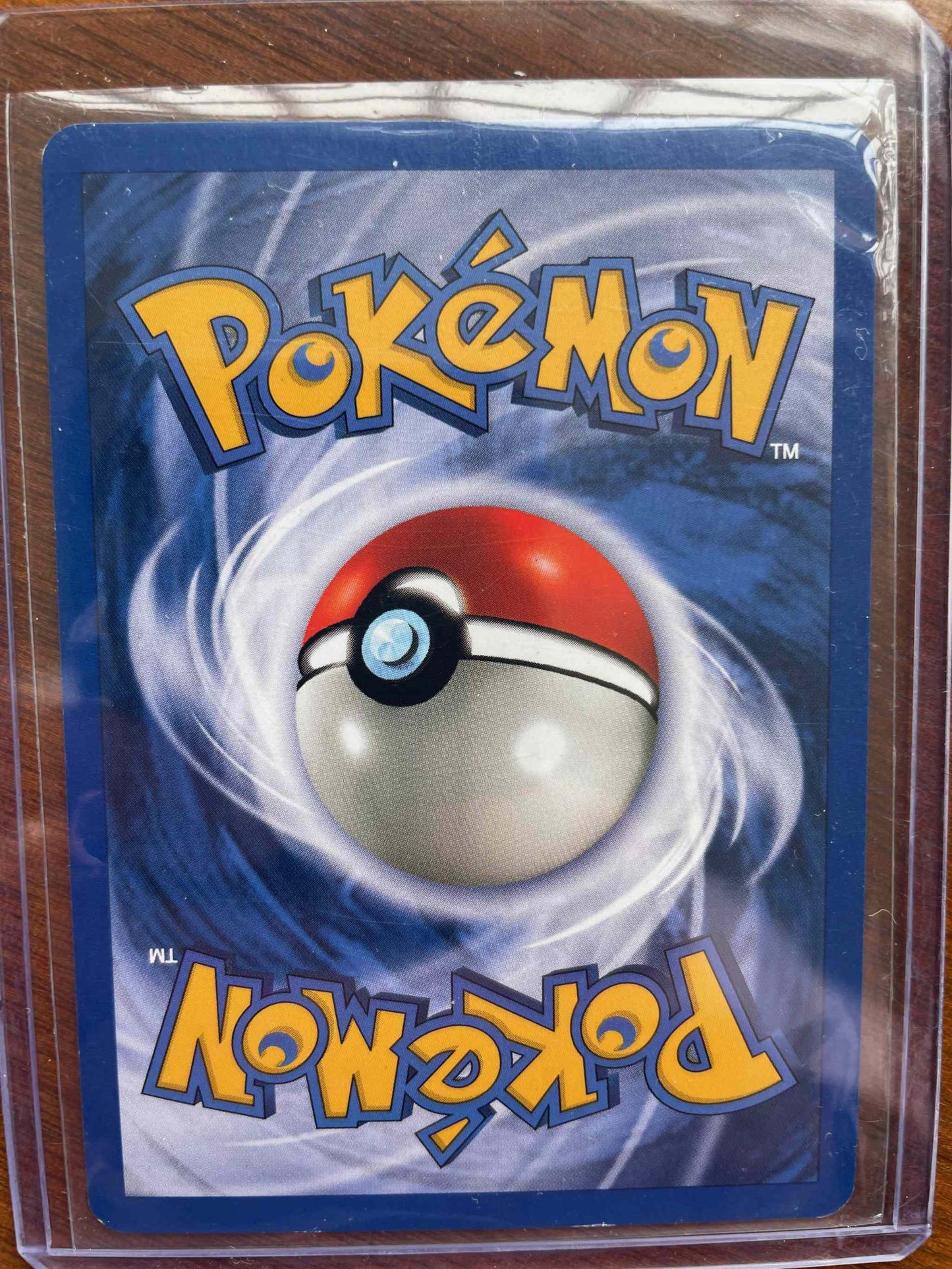 Base Set #009/130 Magneton Pokémon card in protective sleeve.