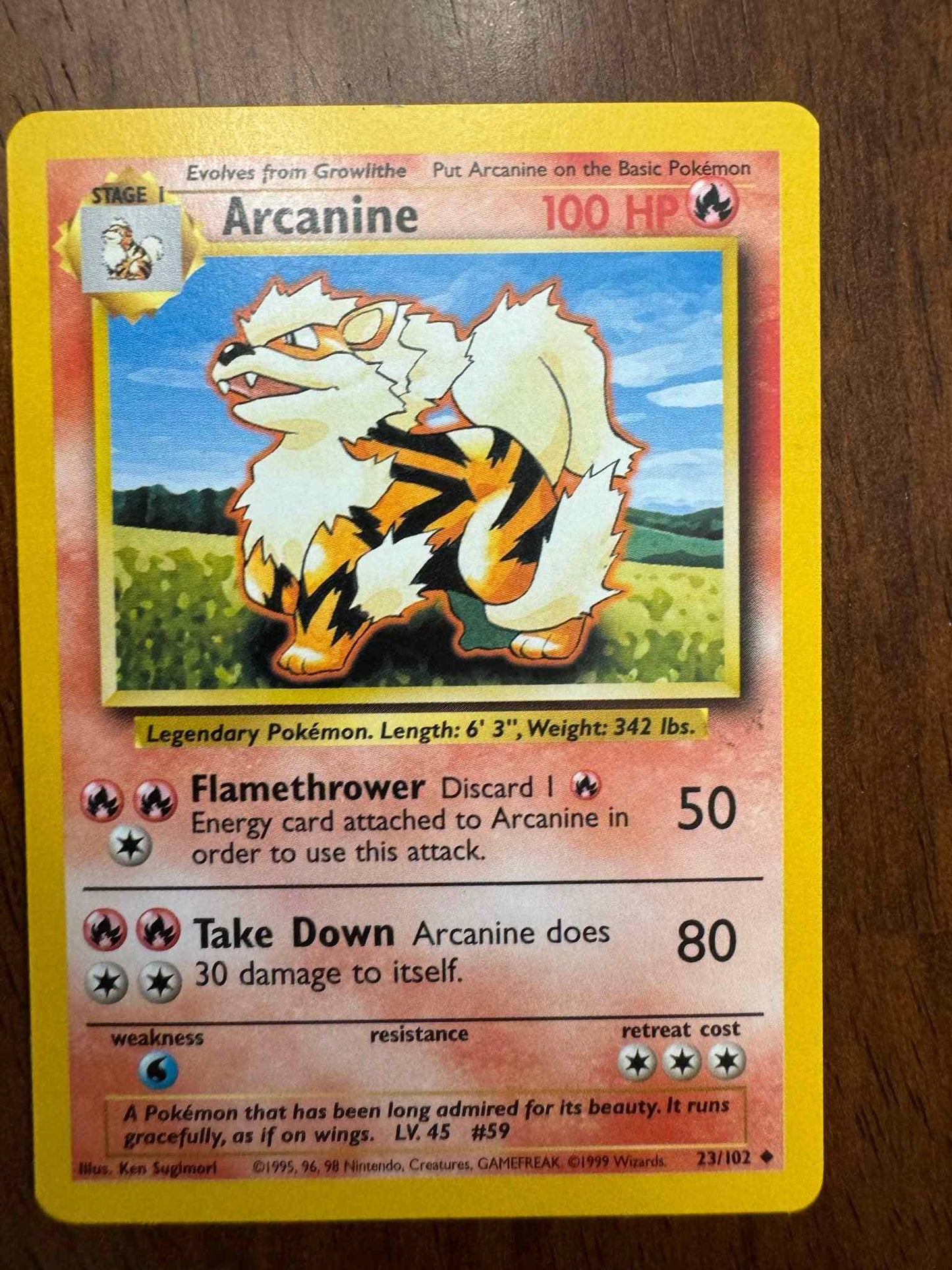 Base Set #023/102 Arcanine collectible Pokemon card with artwork and stats.