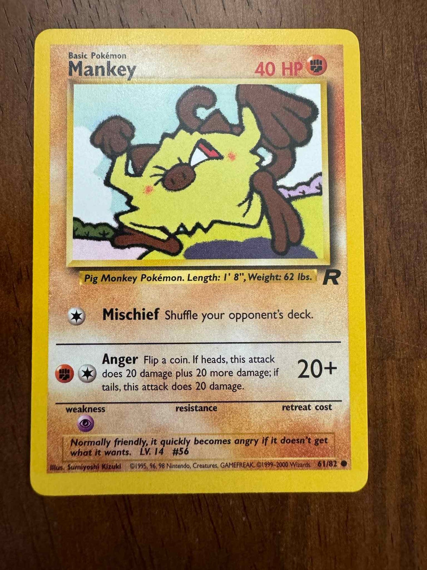 Team Rocket #61/82 Mankey Pokémon card with intricate artwork.