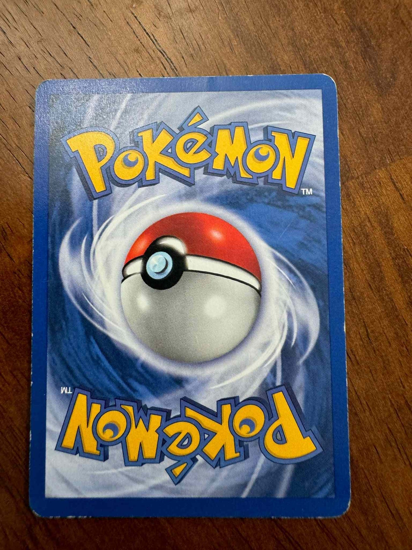 Team Rocket #27/82 Dark Machamp card, rare and powerful collectible.
