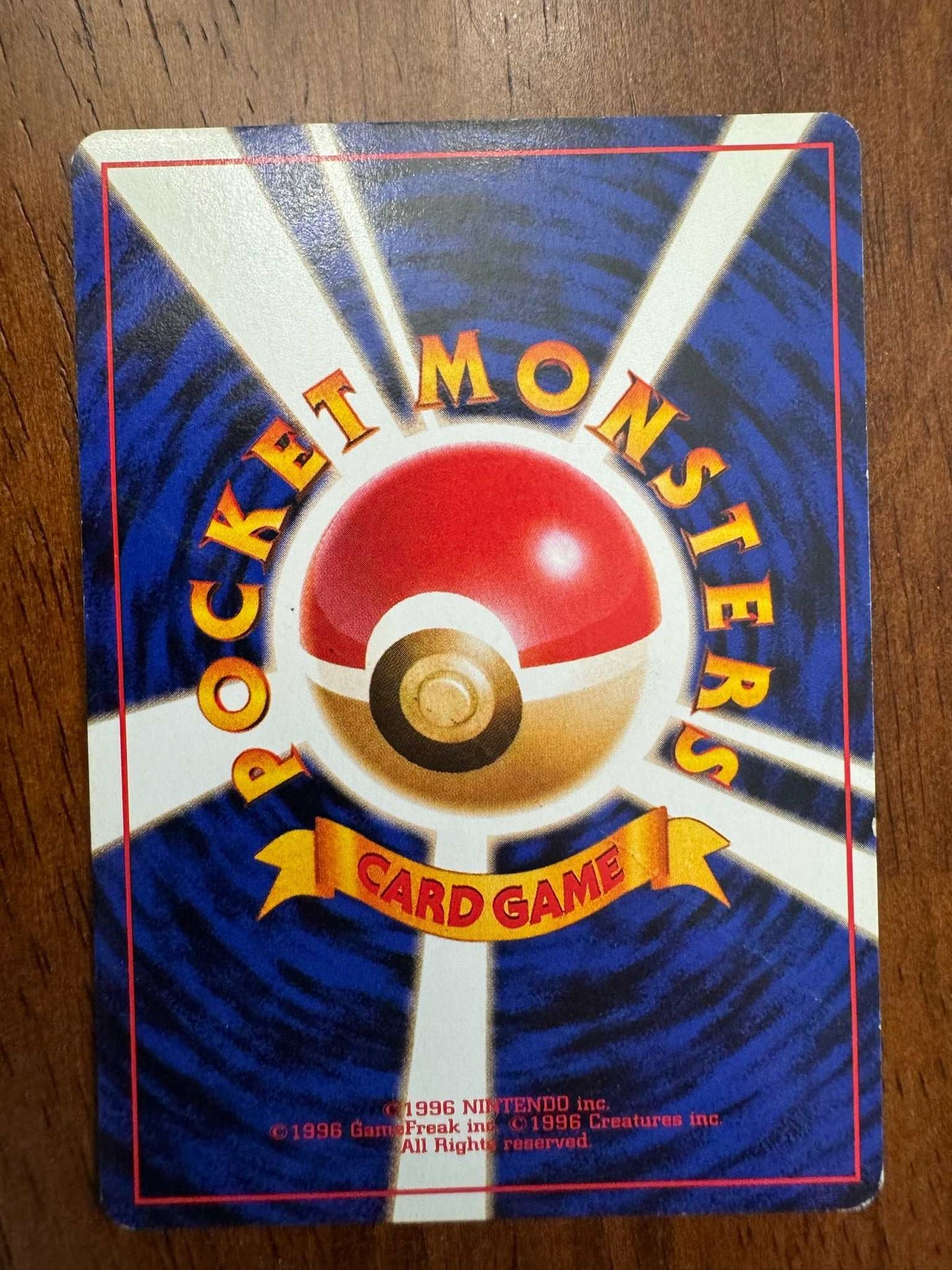 Vintage Surge Pikachu Japanese Pokemon card with old back design.