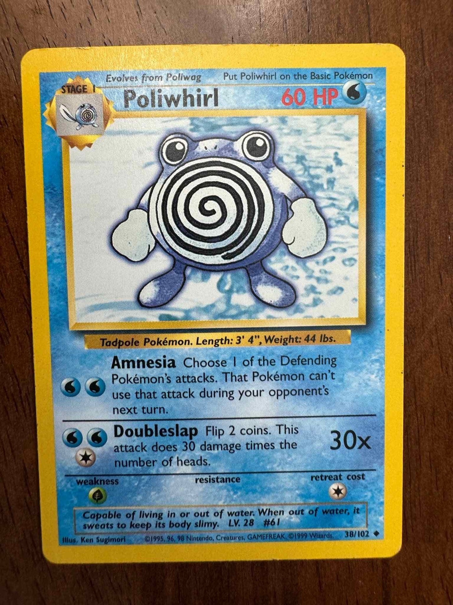 Base Set 038/102 Poliwhirl Pokémon card, collector's item.