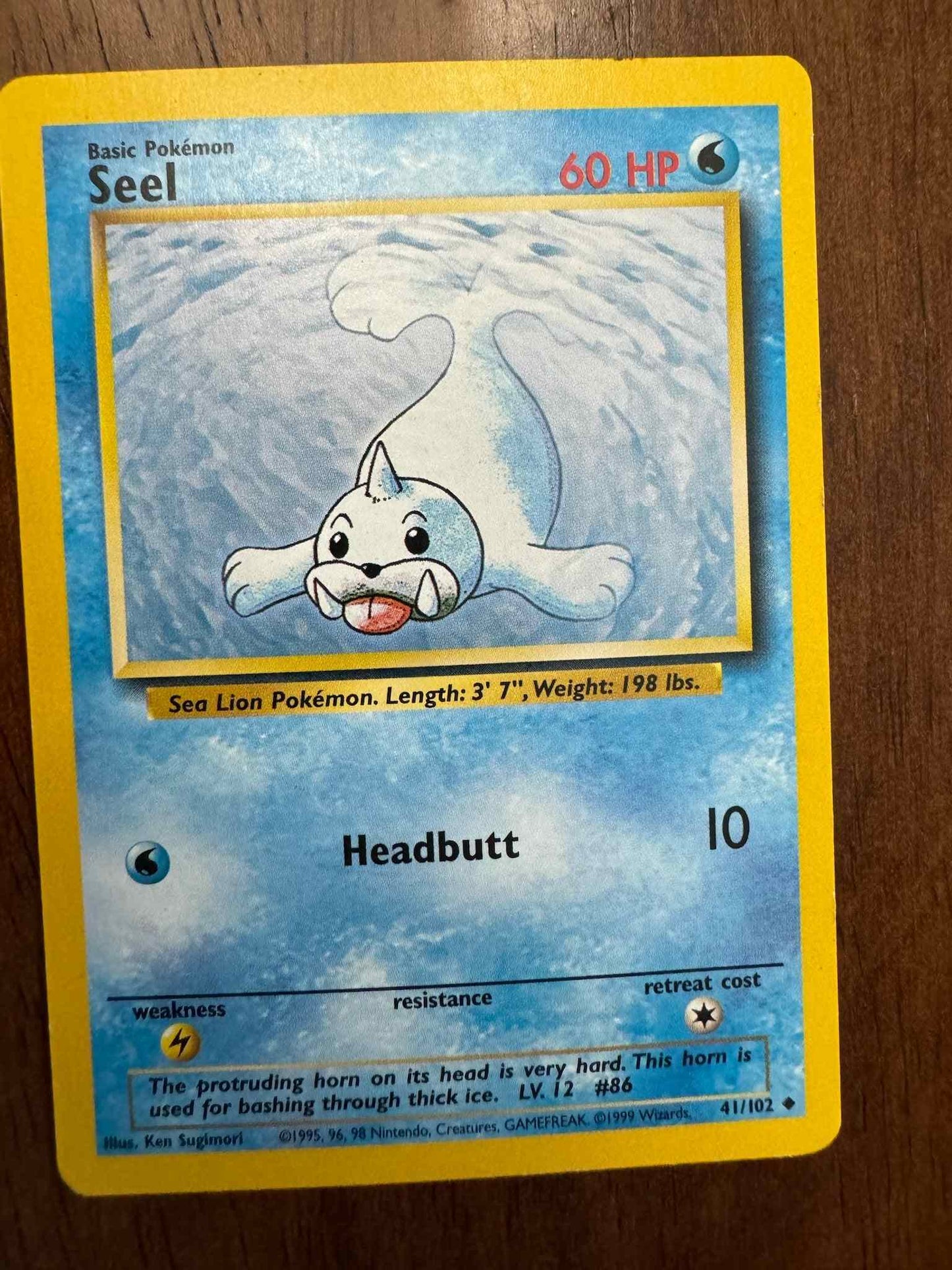 Base Set #041/102 Seel Pokémon card collectible.