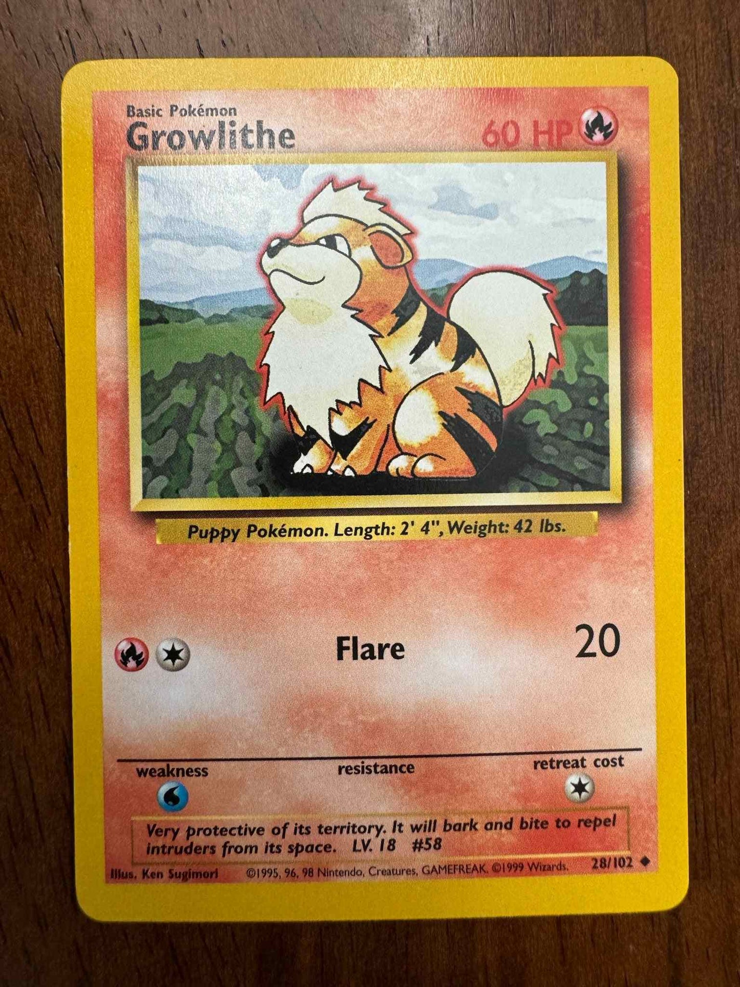 Base Set #028/102 Growlithe Pokémon card collectible.
