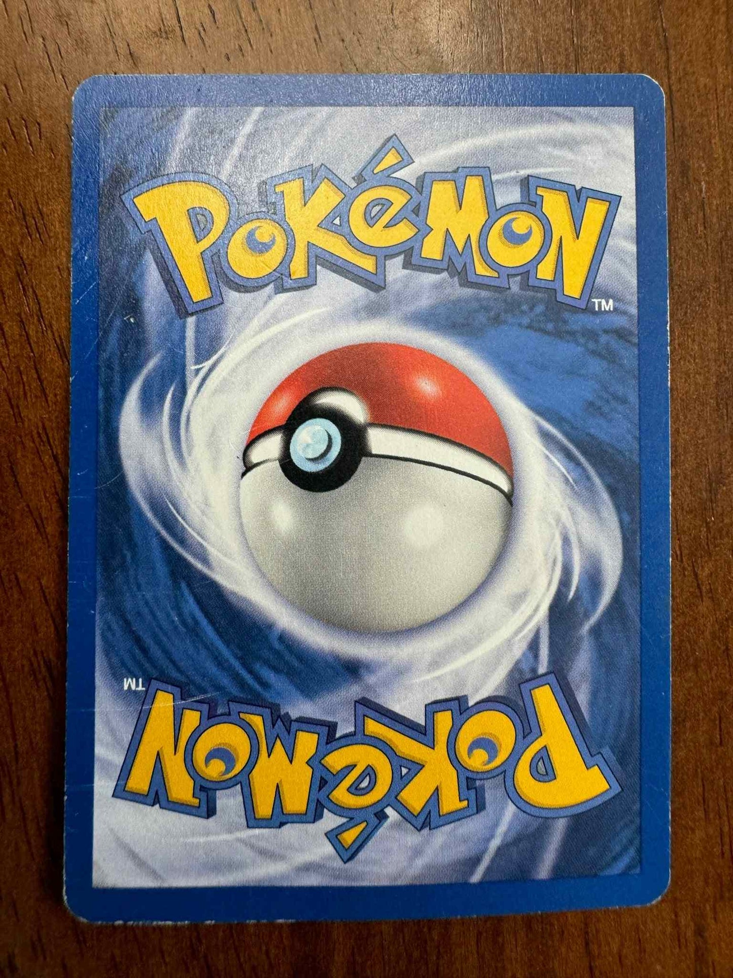 Base Set 2 #054/130 Nidorino Pokemon TCG card with foil design.