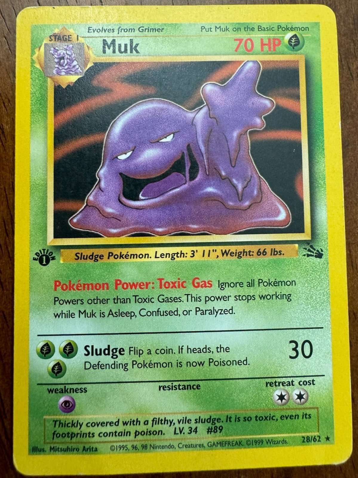 Fossil #28/62 Muk Pokemon card, rare collector's item.