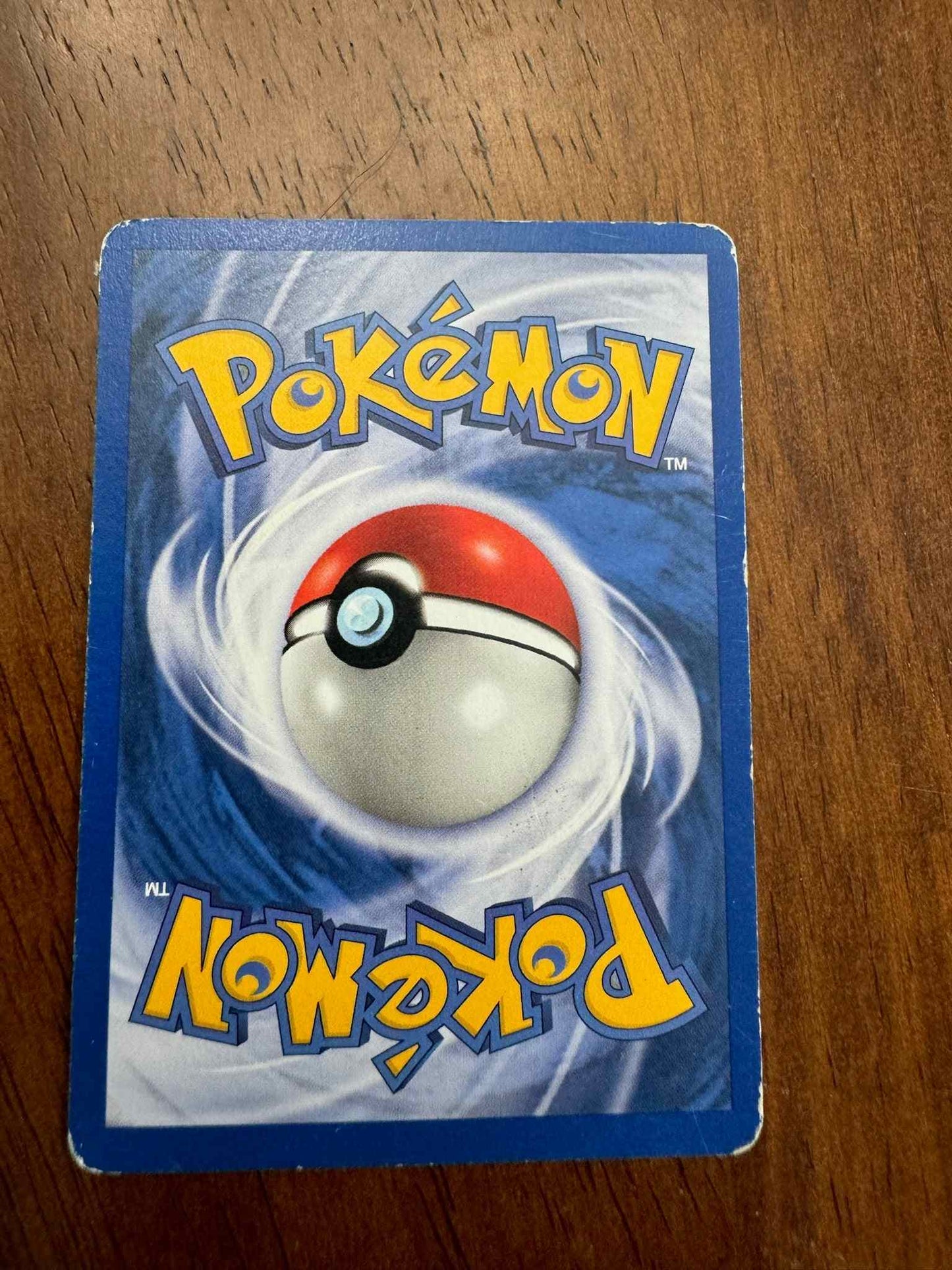 Team Rocket #49/82 Abra Pokémon card with unique design.