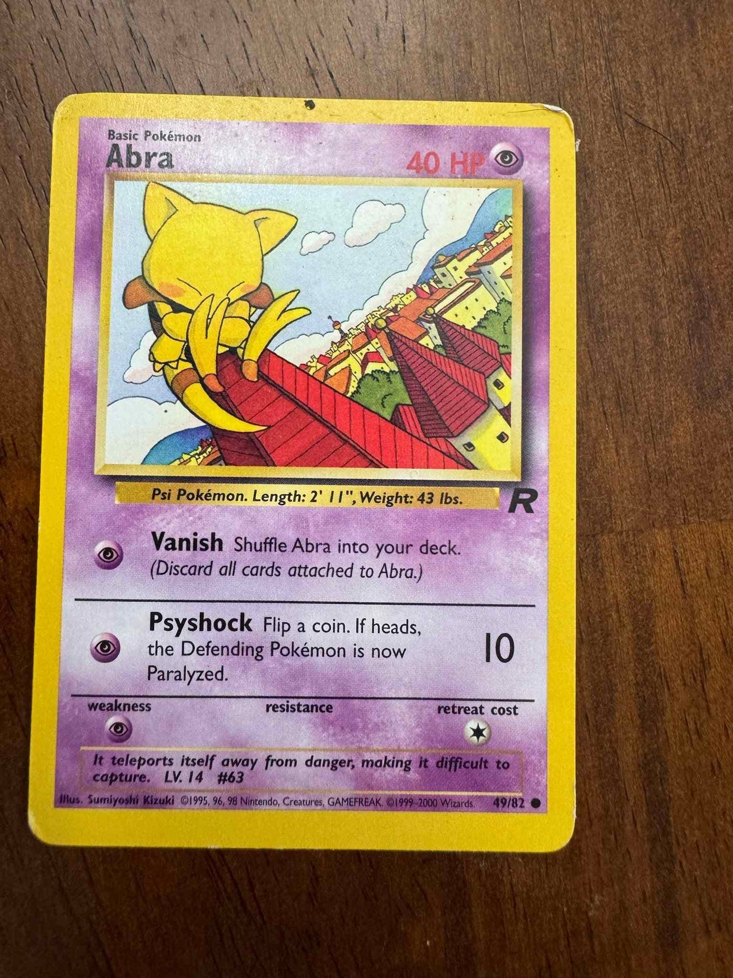 Team Rocket #49/82 Abra collectible card from Team Rocket set.