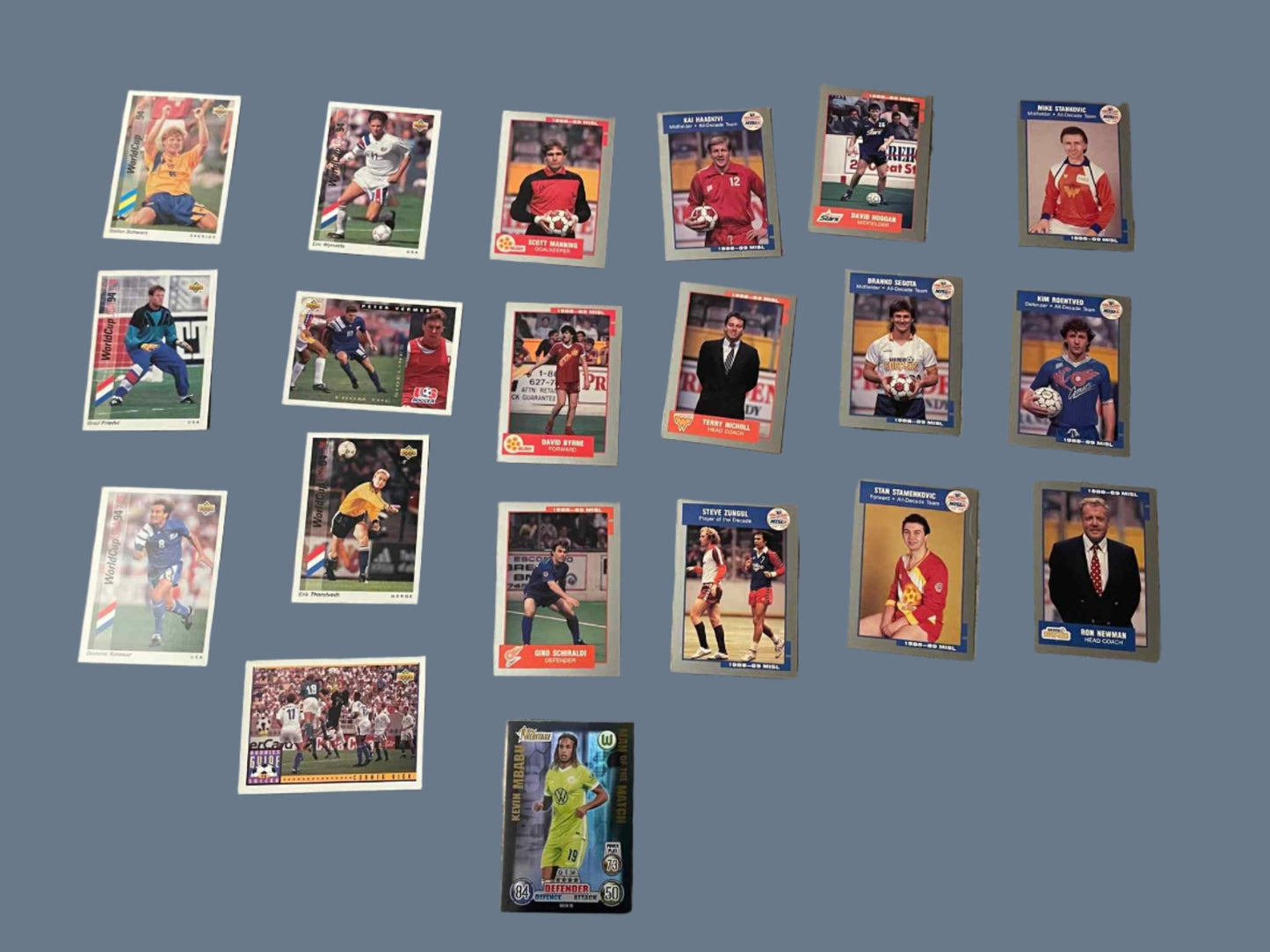 Vintage soccer card lot featuring MISL and Upper Deck cards from the 80s, 90s, 2000s, including players like Eric Wynalda, Terry Nicholl, Branko Segota, and a 2020 Panini Kevin Mbabu card.