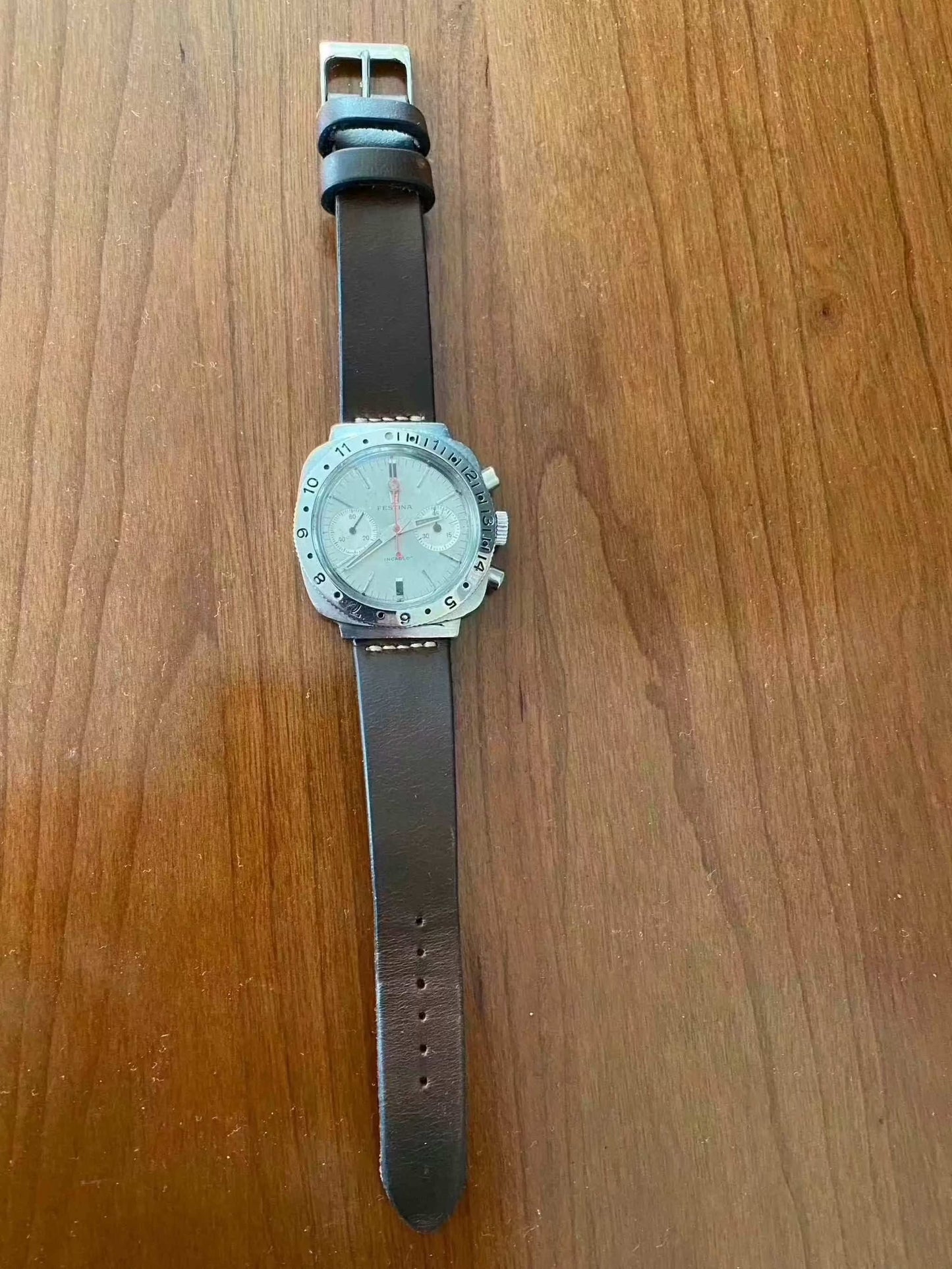 Vintage Festina Incabloc Chronograph Valjoux 7733 38mm watch with silver dial and leather band.