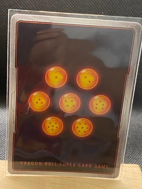 Dragon Ball Super Card Game Ultra Instinct Son Goku card with Dragon Ball design.