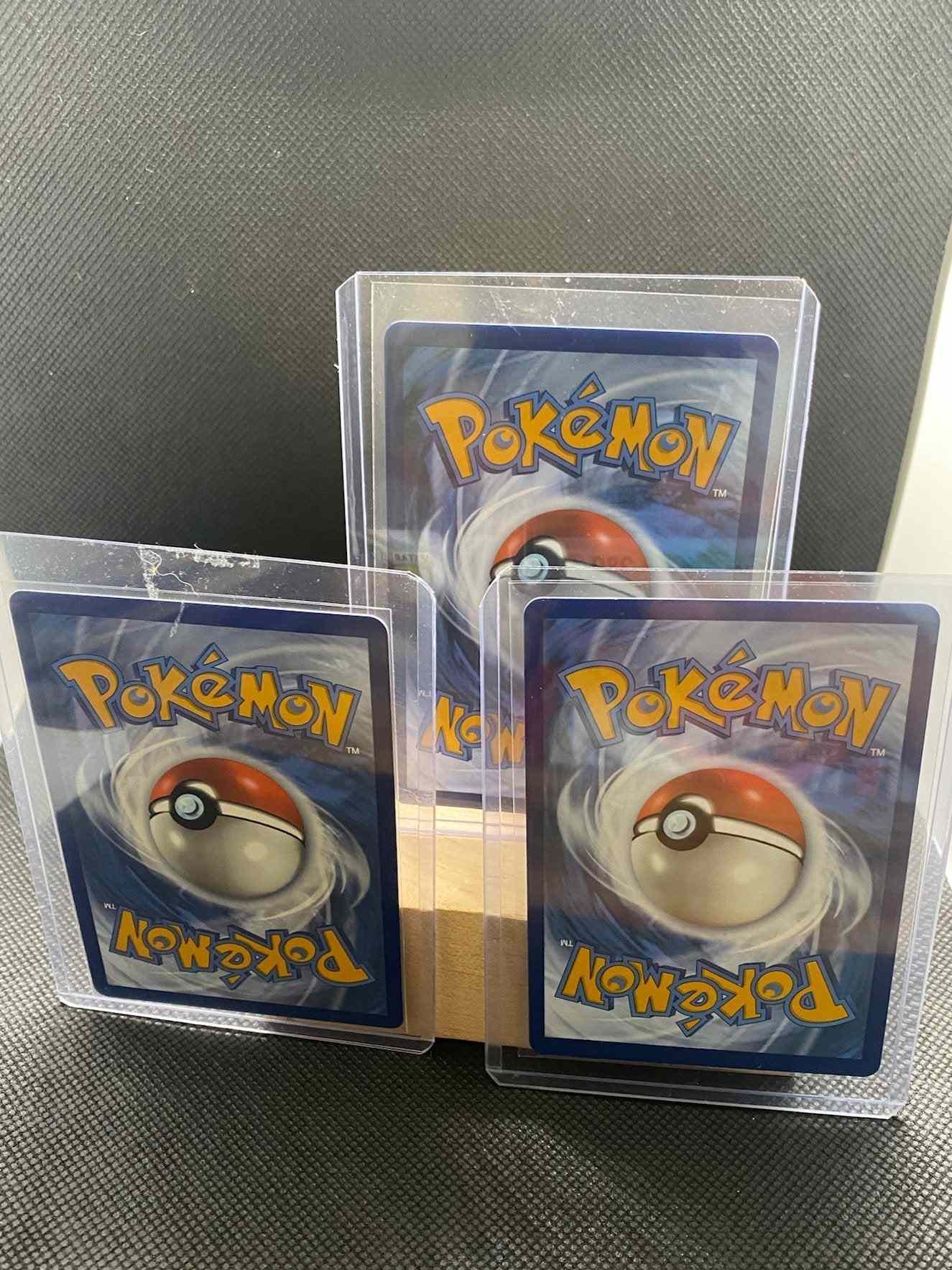 Lugia VSTAR TCG cards set of 3, featuring rainbow and gold secret rare designs, near mint condition.