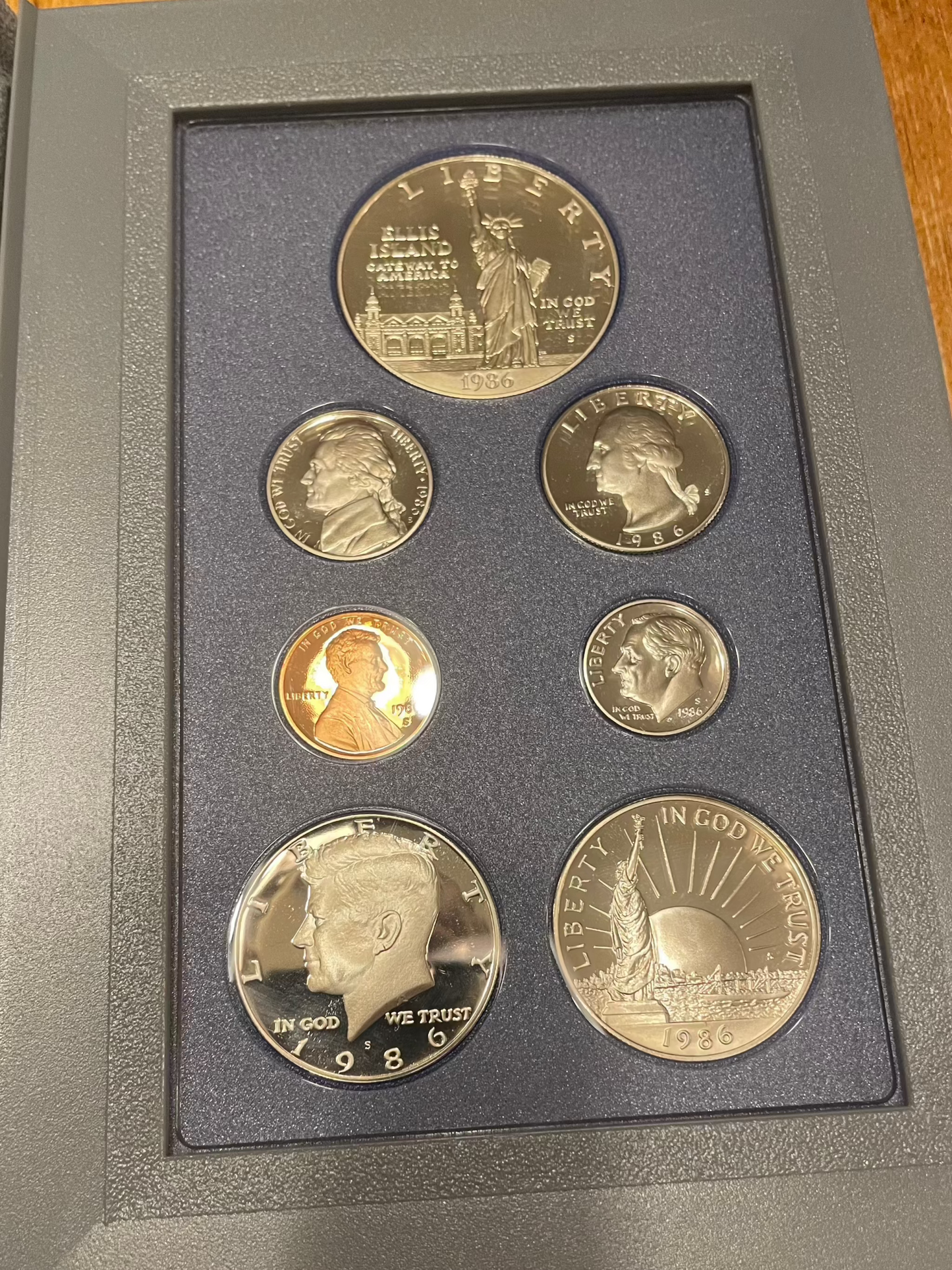 1986 United States Proof Prestige Set with 7 coins and Certificate of Authenticity.