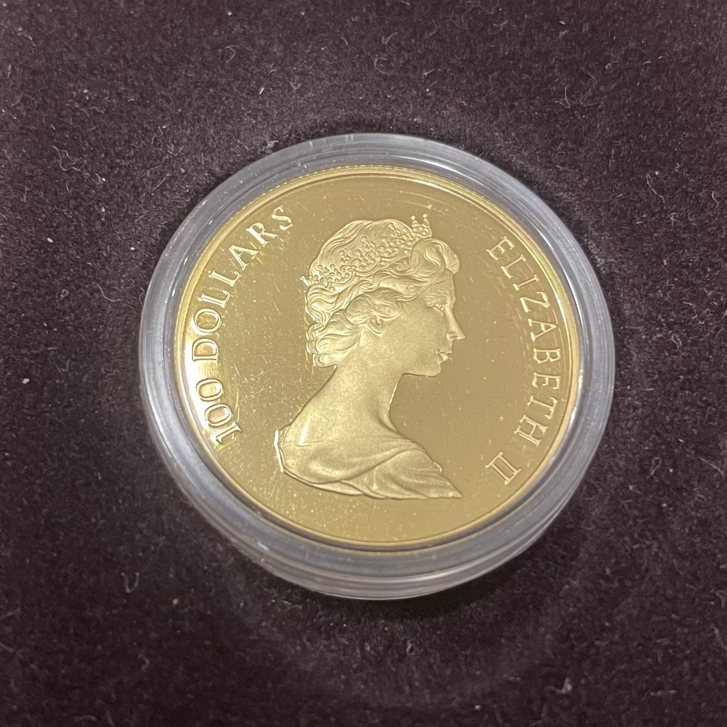 1982 RCM Canadian Constitution $100 Dollar 1/2 oz Gold Coin with Queen Elizabeth II portrait in case.