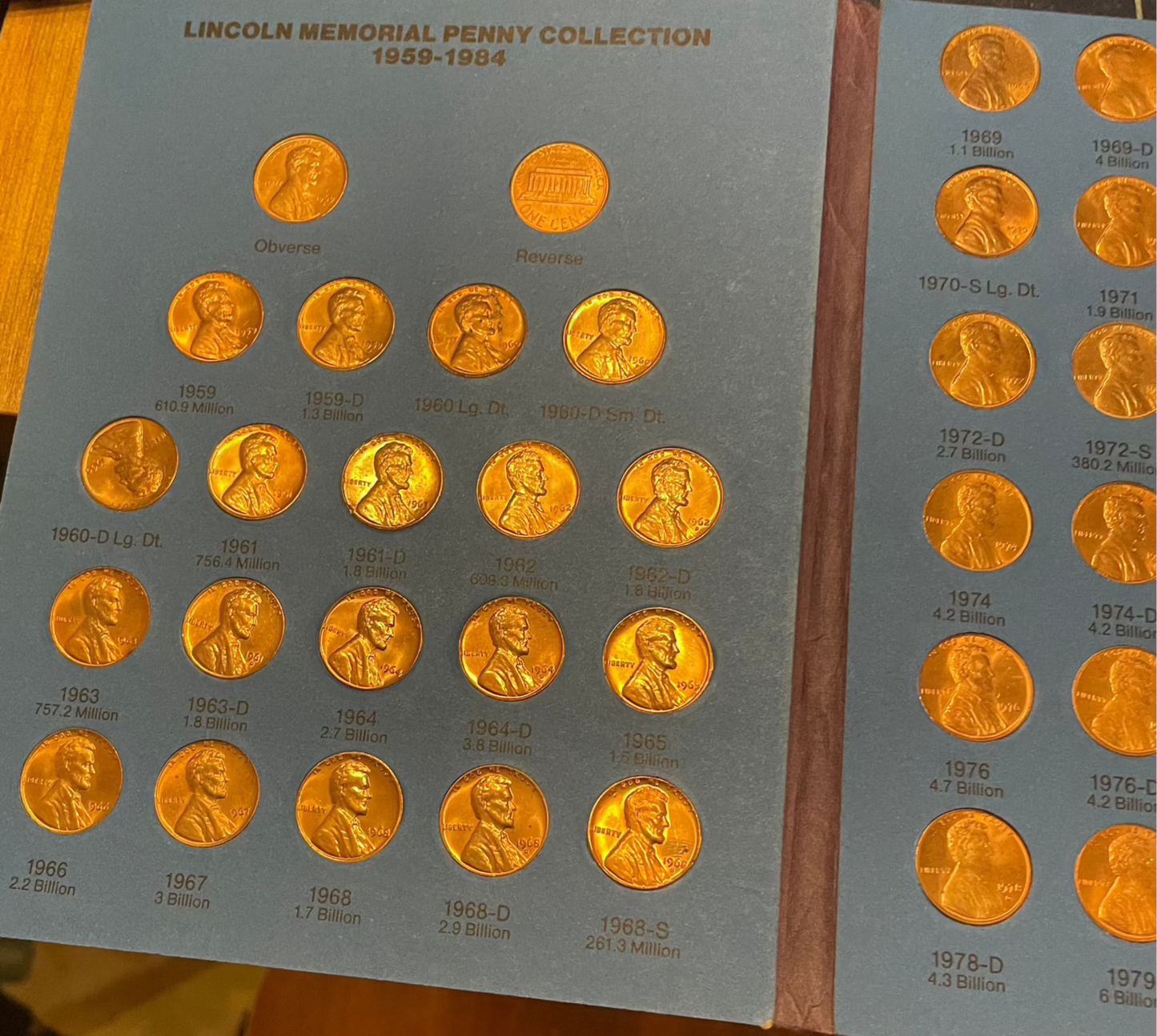 Collector's penny books with Lincoln cents, Indian Head pennies, and near-mint steel cents bonus.