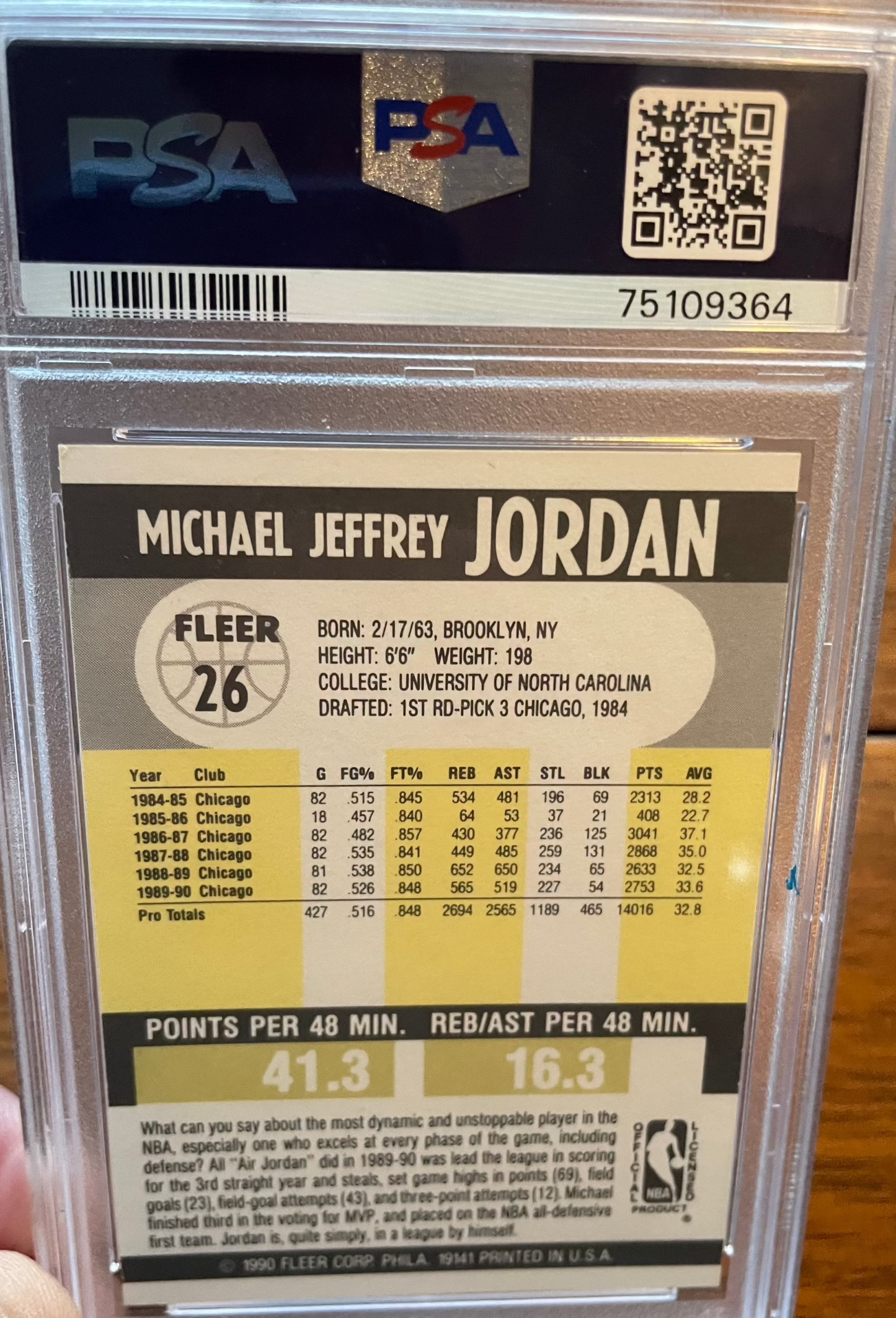 1990 Fleer Michael Jordan Chicago Bulls HOF #26 PSA 7 NM card showcasing player stats.