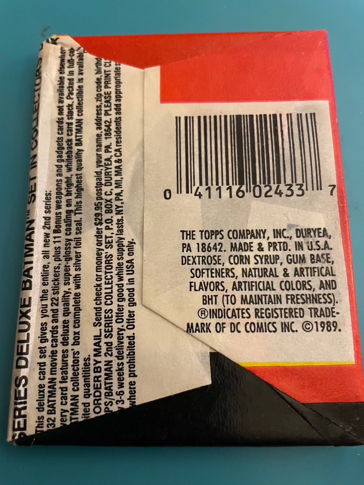1989 Topps Batman sealed wax pack with 9 cards and 1 sticker.