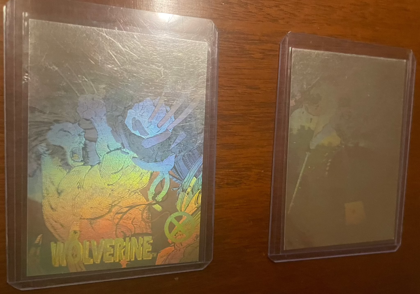 1992 Marvel Impel hologram cards featuring Wolverine and Gambit, showcasing stunning holographic effects in protective sleeves.