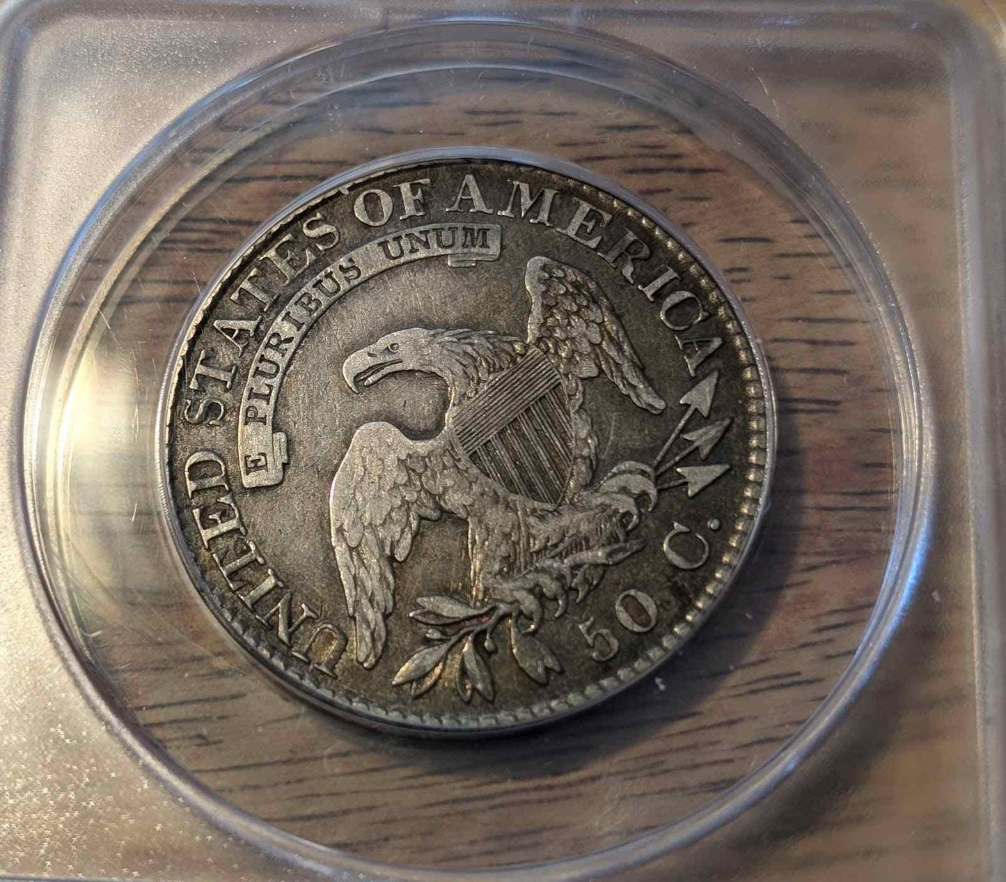 1824 CAPPED BUST HALF coin VF20 in protective case, United States.