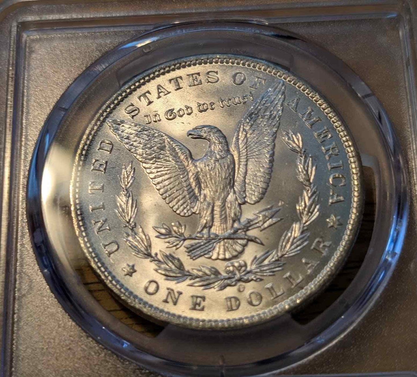 1898 Morgan Silver Dollar MS63 coin in protective case.