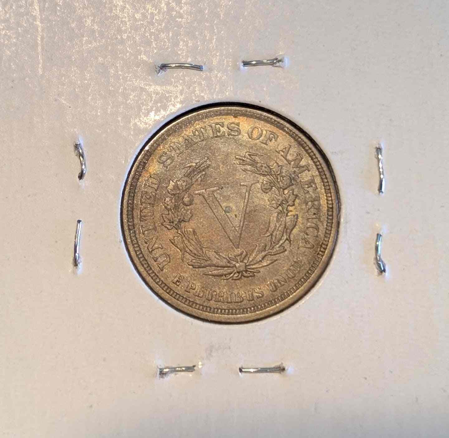 1883 Liberty Head Nickel without cents in protective holder.
