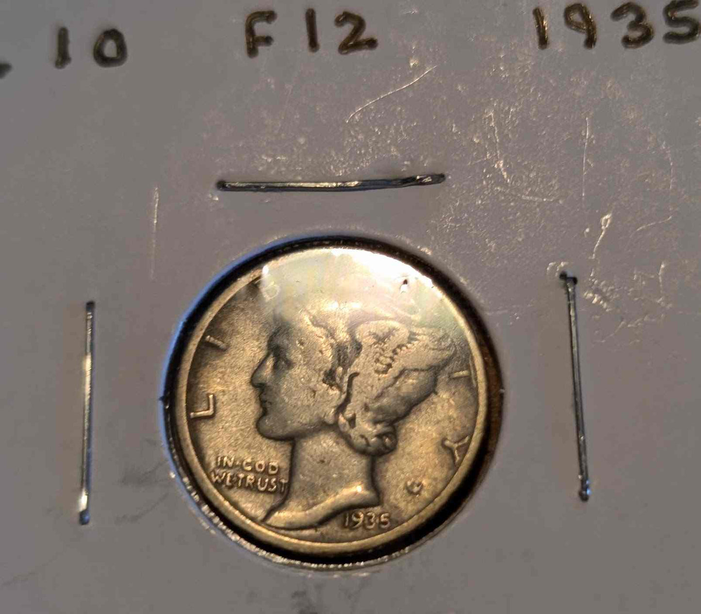 1935 Mercury Dime featuring Roman god Mercury, a collectible piece of American history.