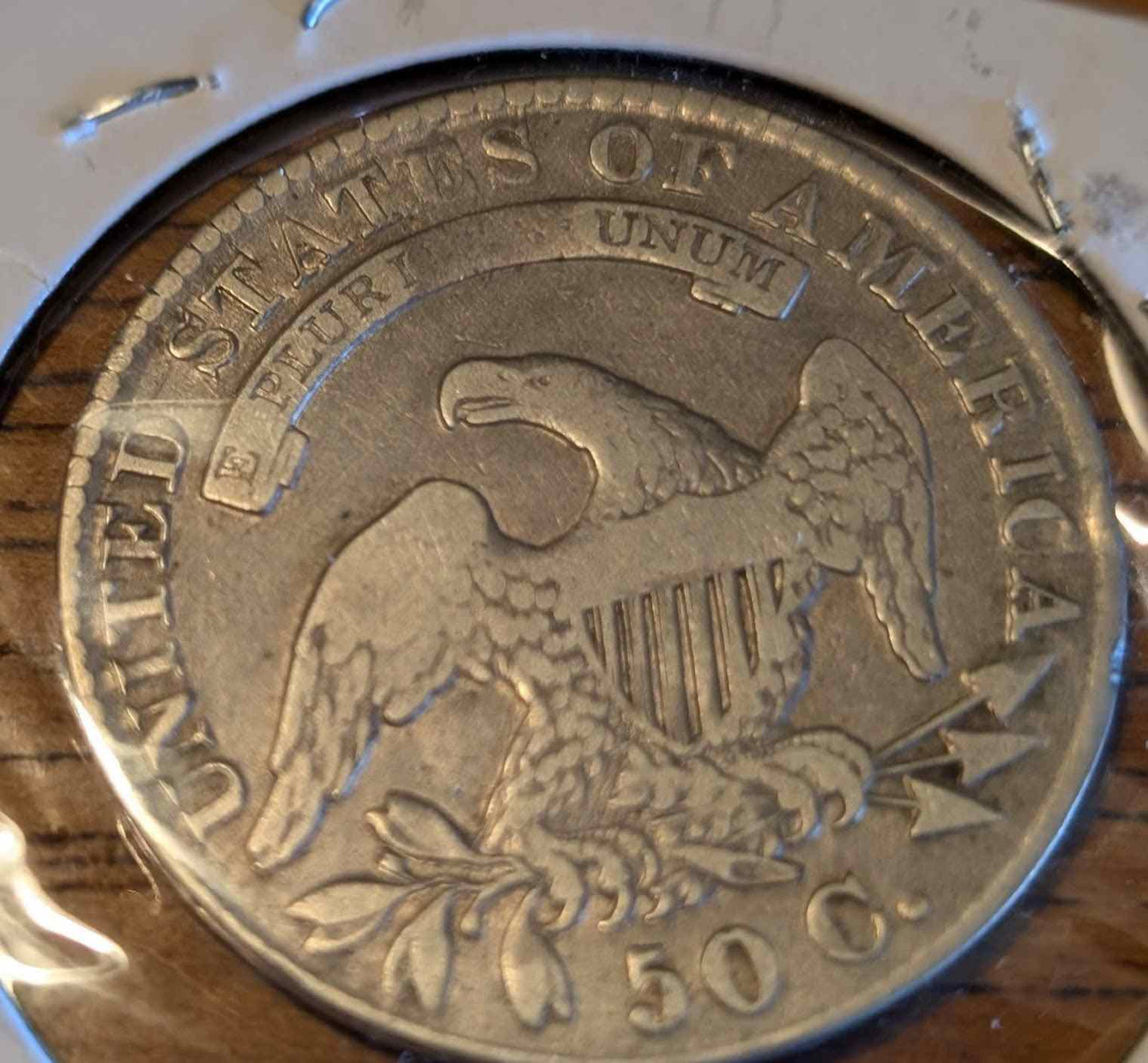 1830 Capped Bust Half (small O) coin featuring intricate design.
