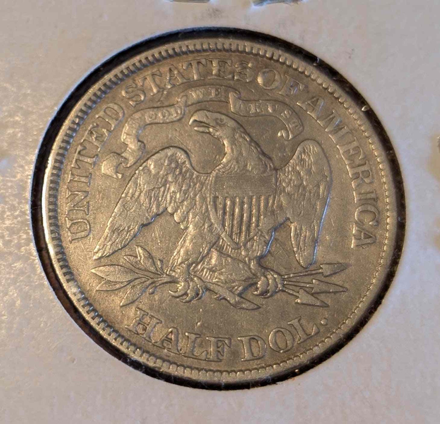 1876 Liberty Seated Half coin with motto, premium quality for collectors.