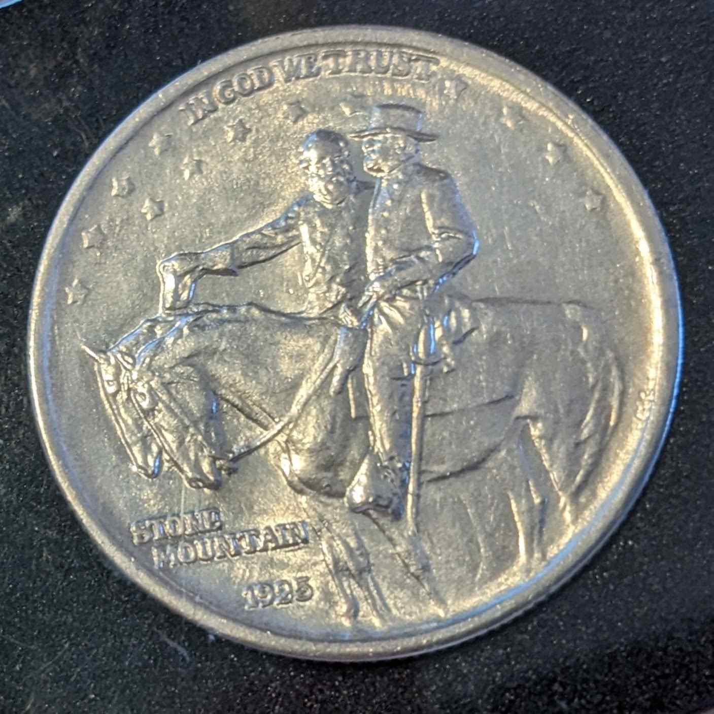 1925 STONE MOUNTAIN HALF coin featuring historical engraving.