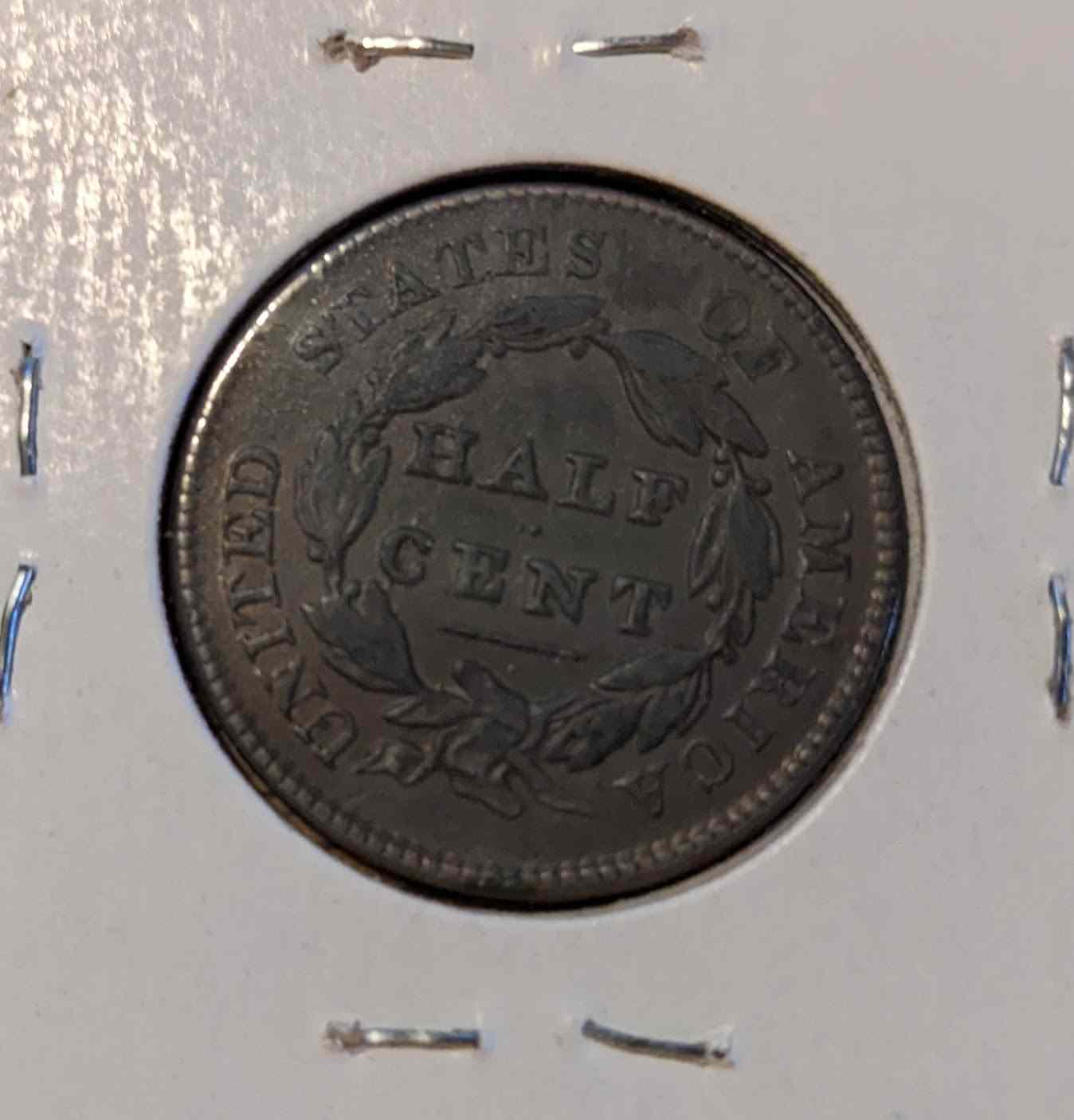 Classic Head Half Cent coin showcasing vintage design.