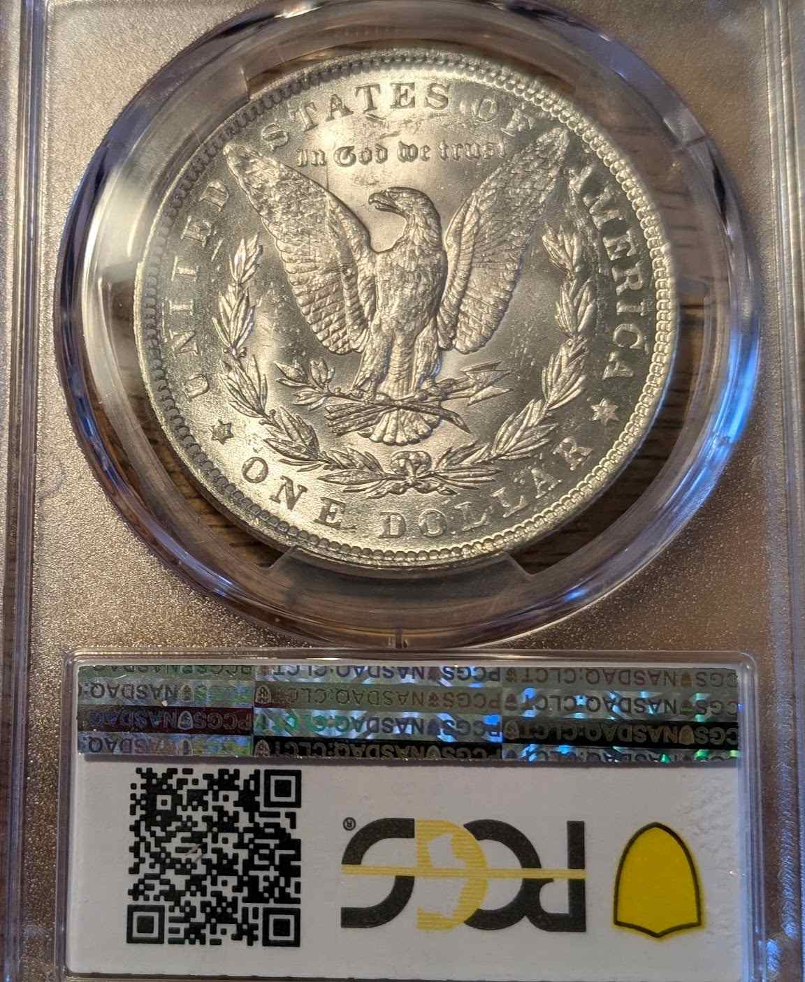 1888 Morgan Silver Dollar MS63 in protective case, showcasing iconic American design.