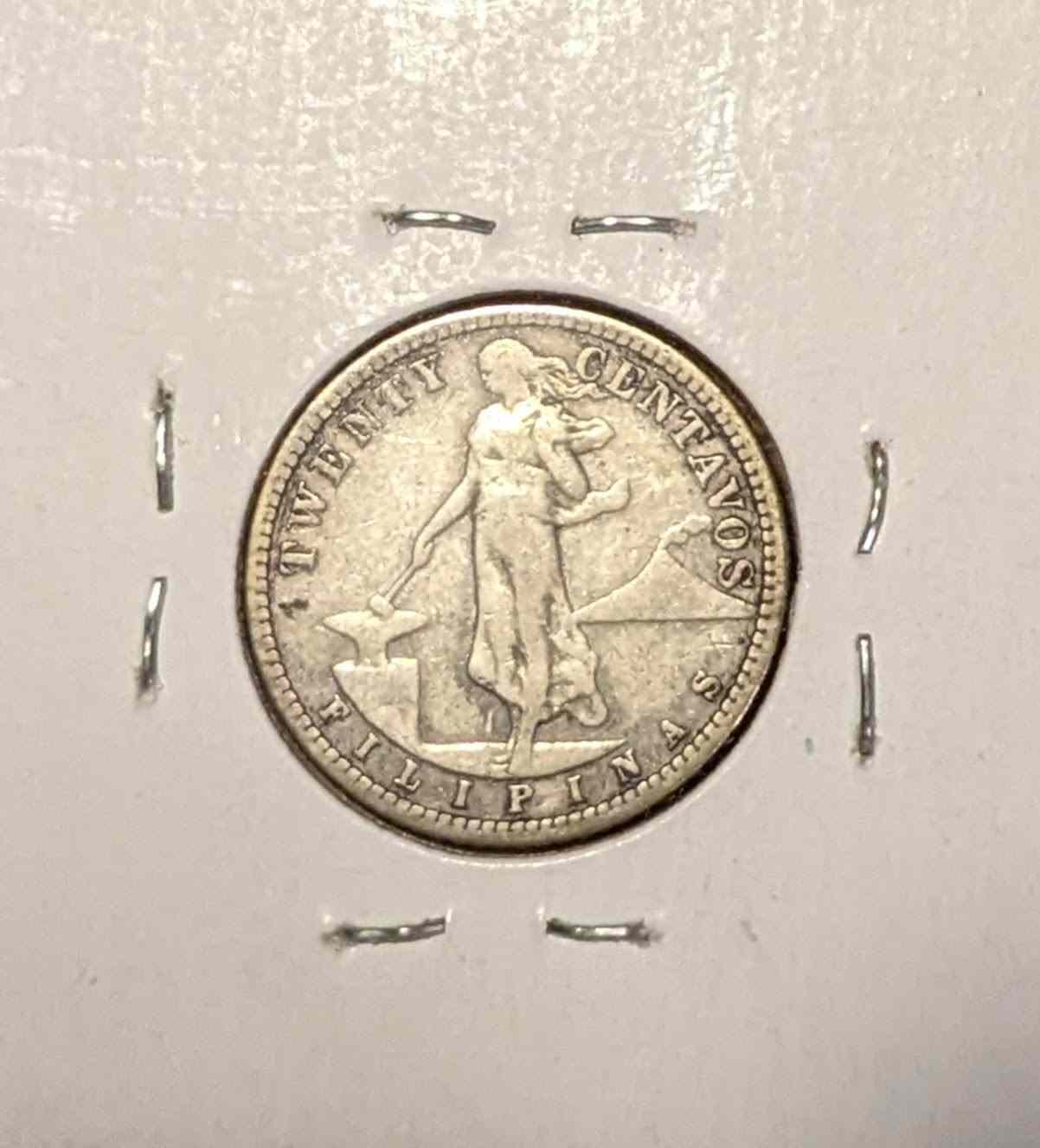 1907 Philippine twenty-cent coin with intricate design in good condition.