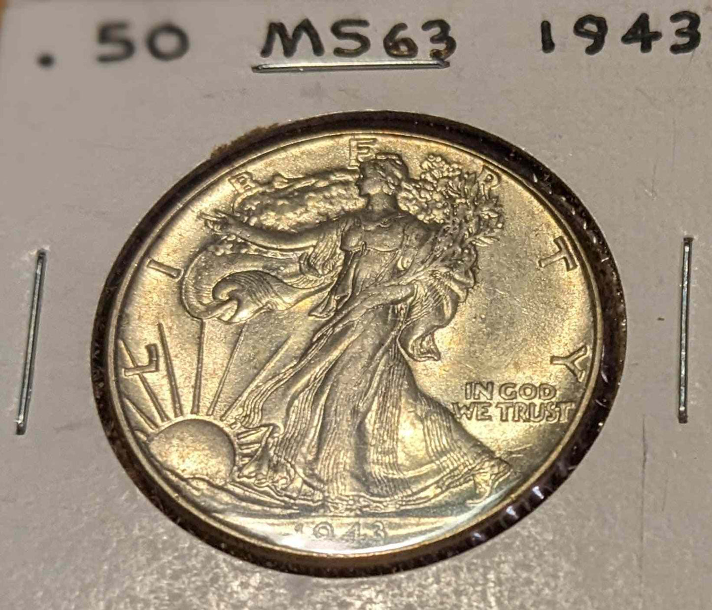 1943 Walking Liberty Half coin, 90% silver, Lady Liberty with olive and oak branches.