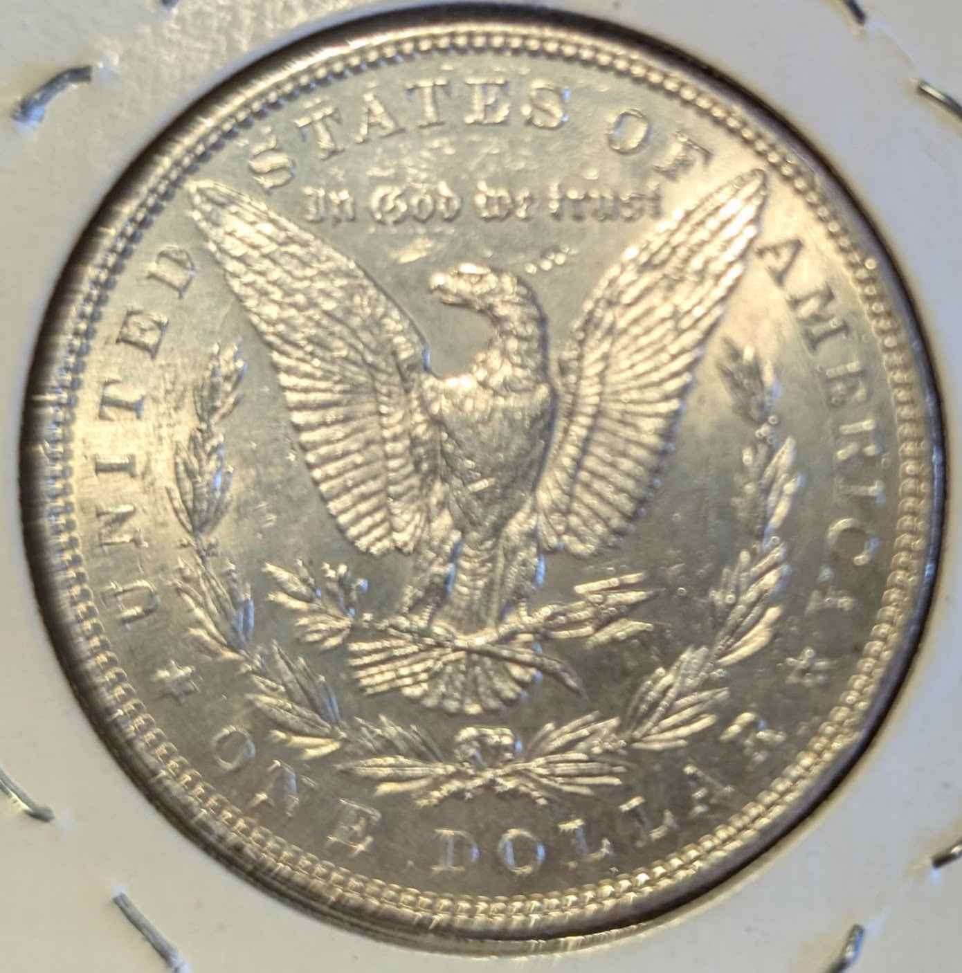 1885 Morgan Silver Dollar, brilliant uncirculated quality, rare collector's coin.
