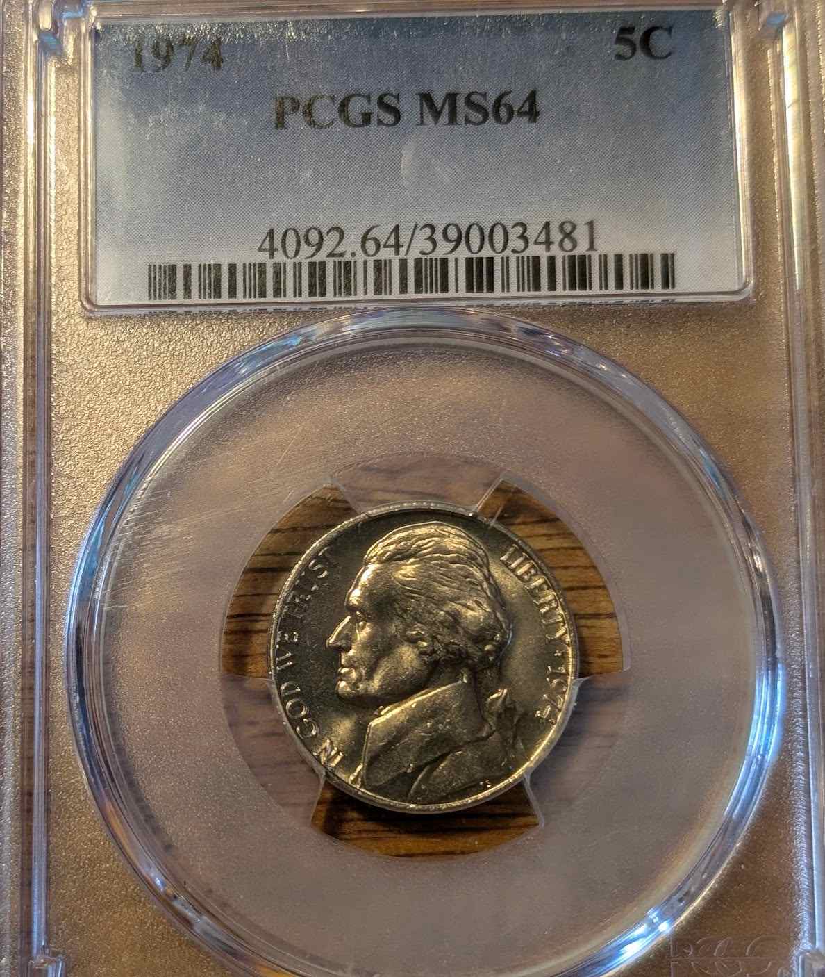 1974 Jefferson nickel in MS64 condition with flawless finish displayed in a protective case.