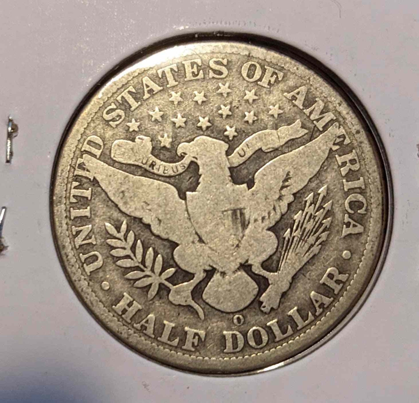 1900 O Barber Half Dollar coin, collectible numismatic silver and copper.